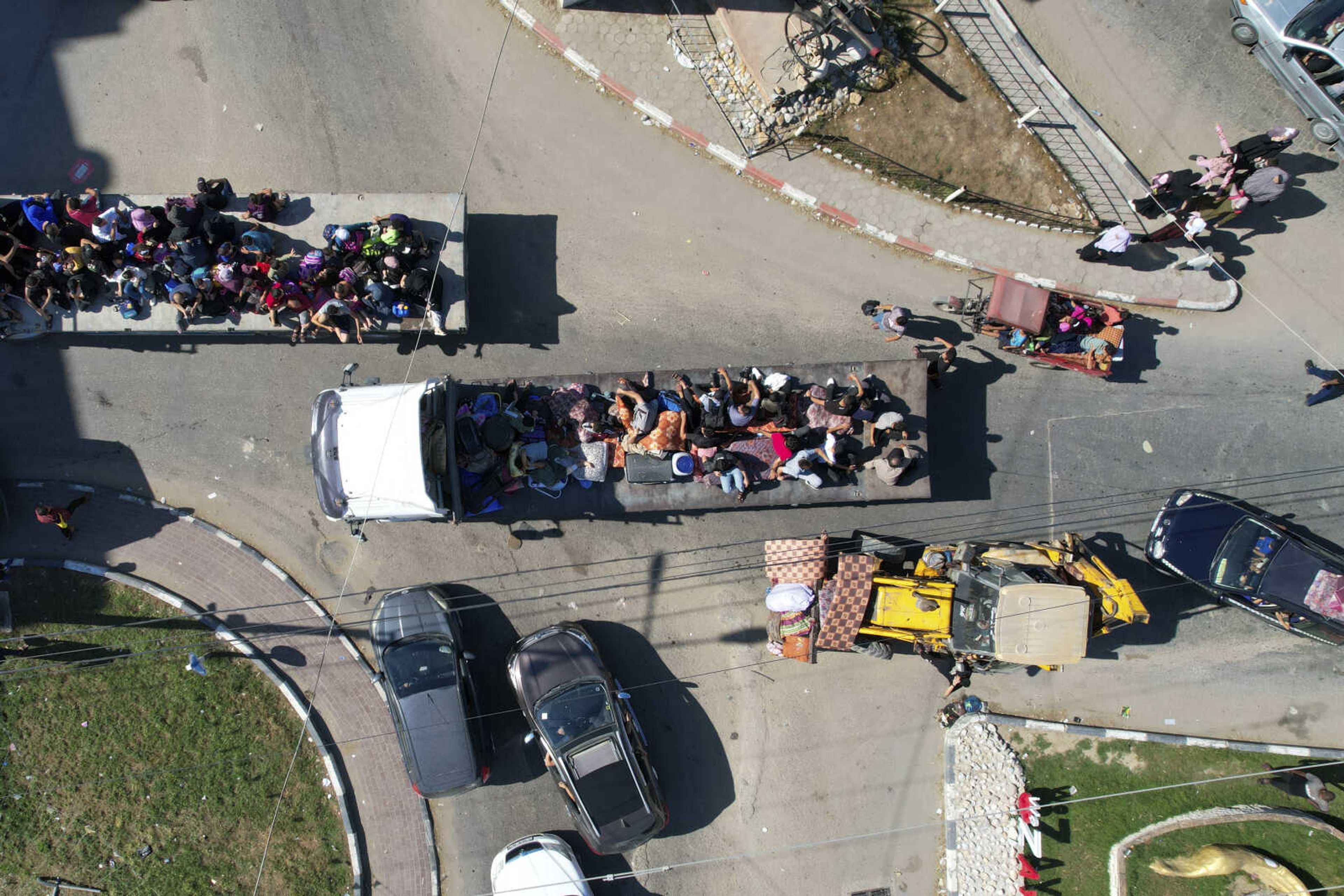 Palestinians flee from northern Gaza to the south after the Israeli army issued an unprecedented evacuation warning to a population of over 1 million people in northern Gaza and Gaza City to seek refuge in the south ahead of a possible Israeli ground invasion, Friday, Oct. 13, 2023. (AP Photo/Hatem Moussa)