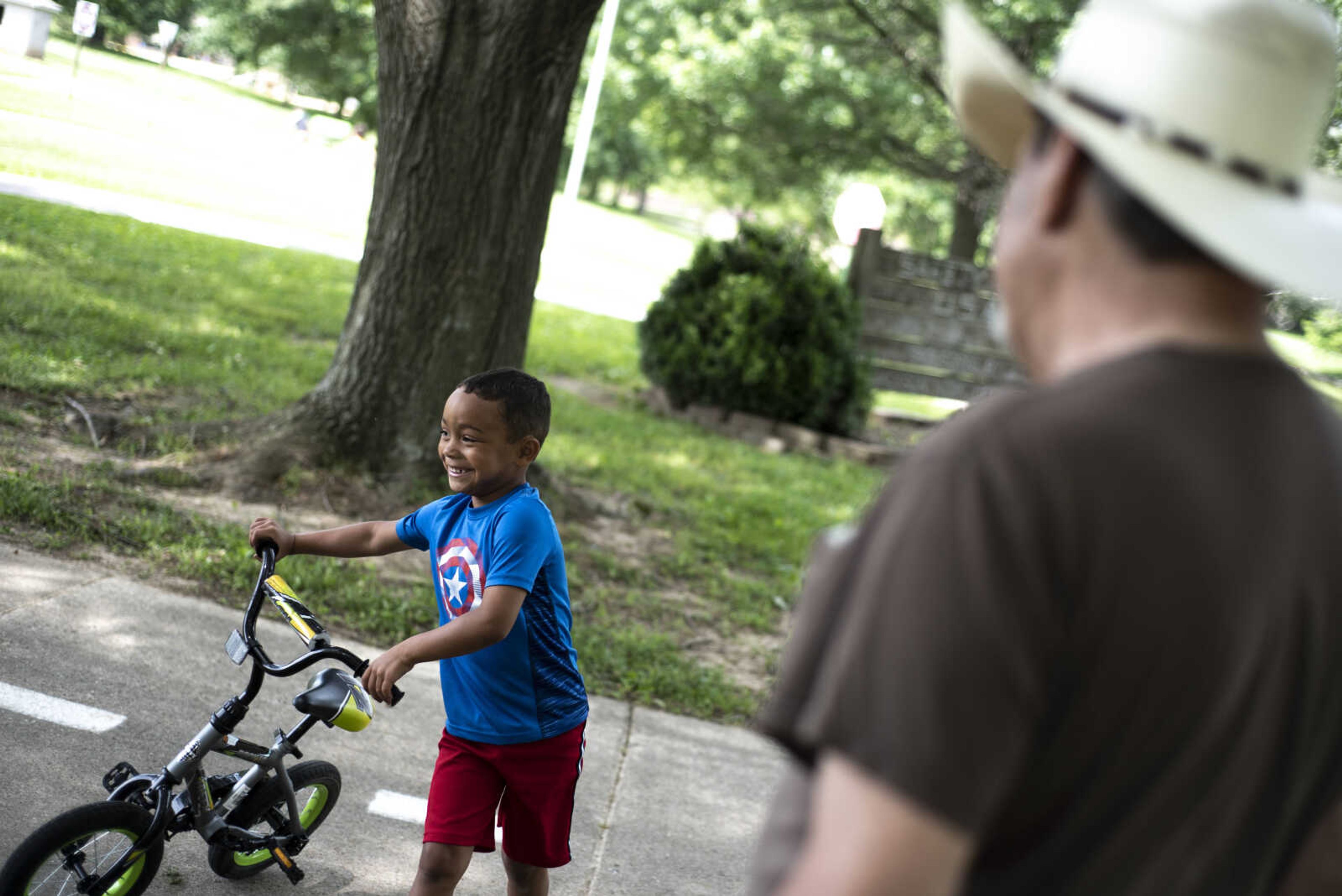 Jayce Holmes, 5, laughs after an exchange with his great-grandpa Carl Holmes while spending the afternoon at Safety City USA at City Park Tuesday, June 11, 2019, in Jackson.