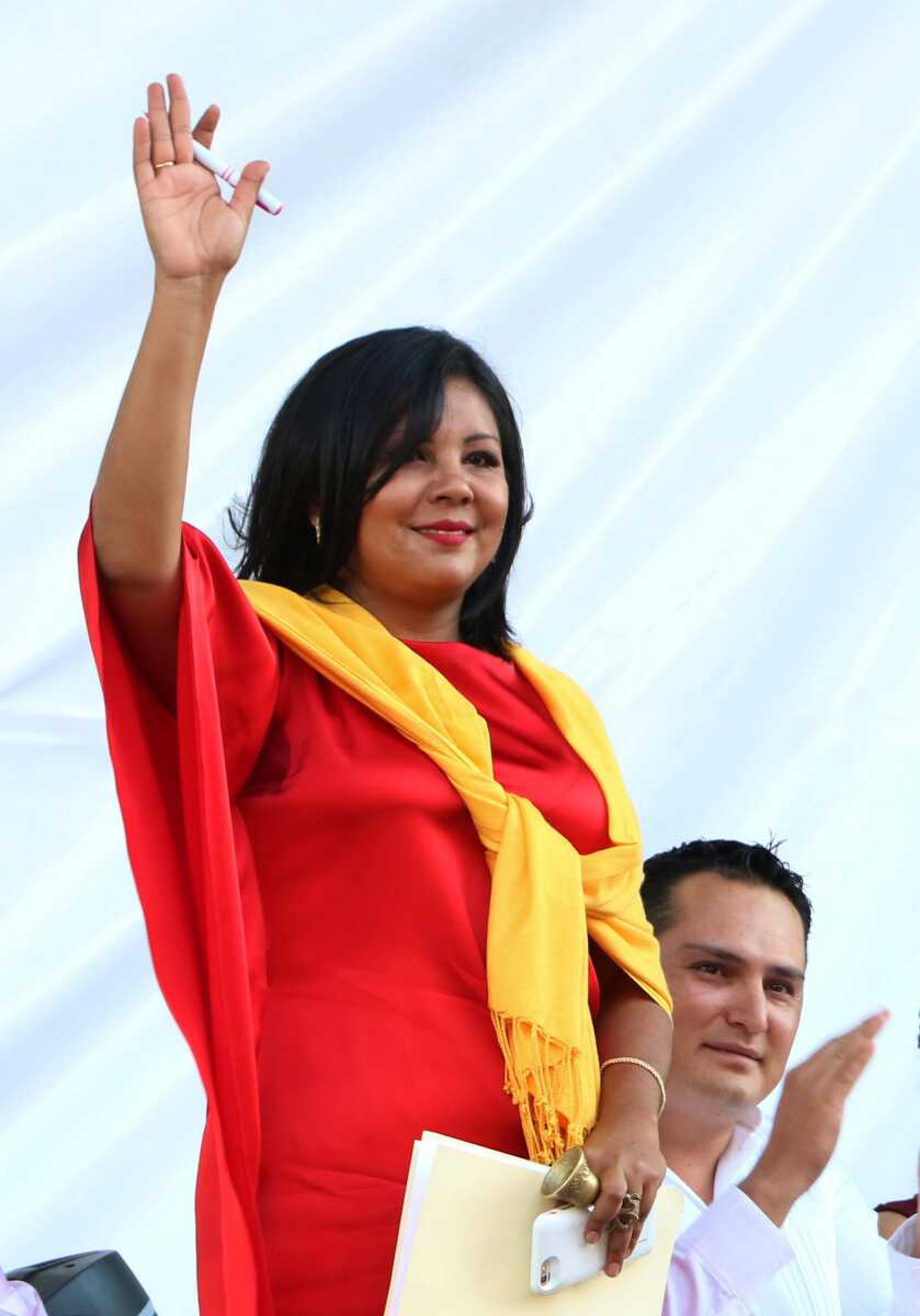 Gisela Mota waves during her swearing-in ceremony Friday as mayor of Temixco, Morelos State, Mexico. (Tony Rivera ~ Associated Press)