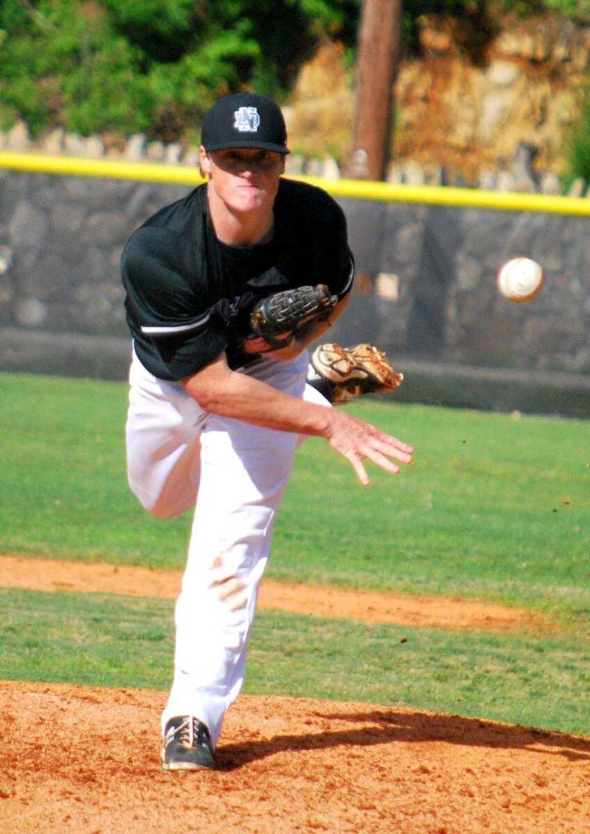 Notre Dame's Graham Ruopp delivers a pitch during Thursday's Class 4 District 1 championship against Perryville in Doniphan, Missouri. (Trent Singer)