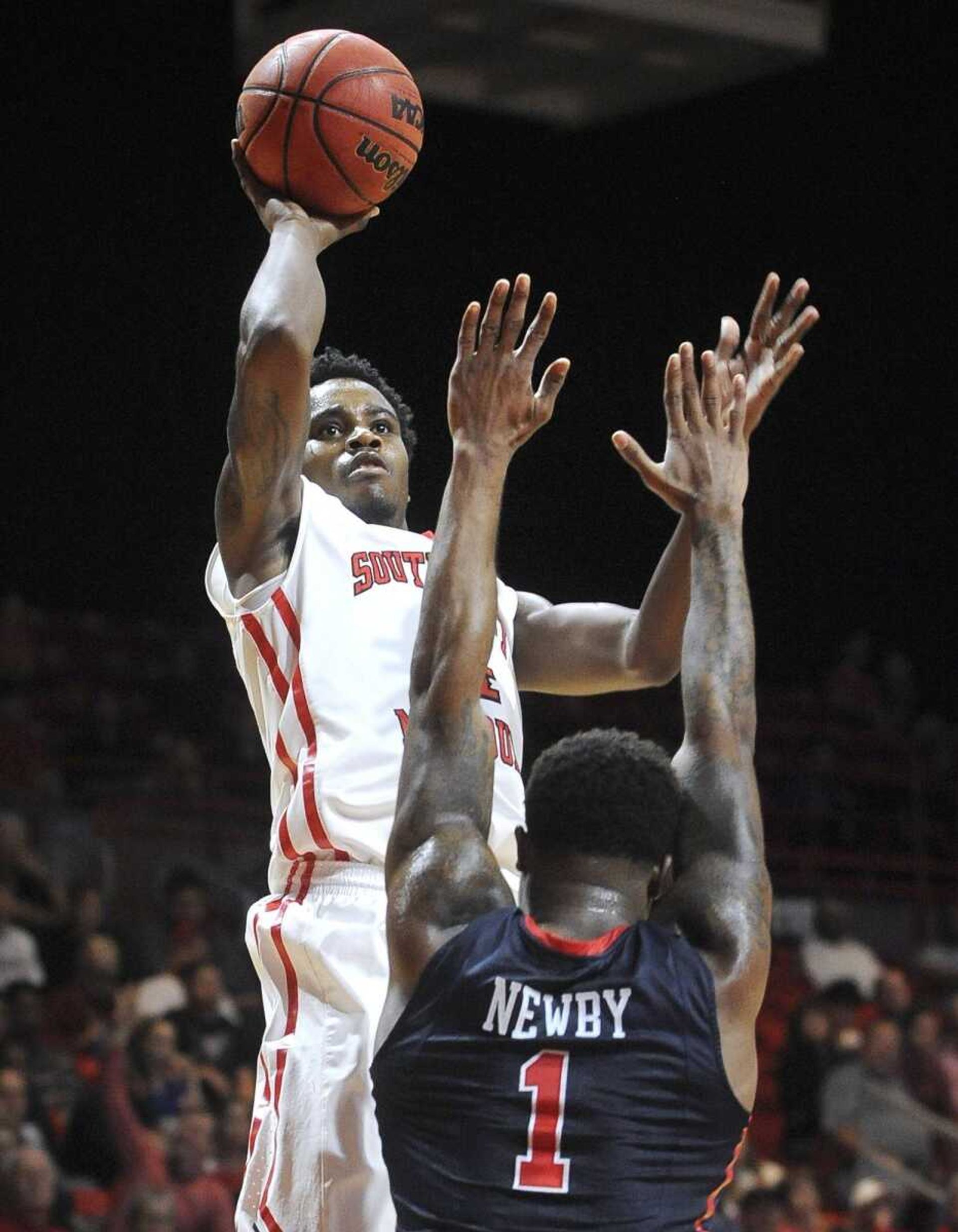 Southeast Missouri State's Antonius Cleveland takes a shot over Ole Miss' Martavious Newby during the first half Saturday, Dec. 12, 2015 at the Show Me Center. (Fred Lynch)