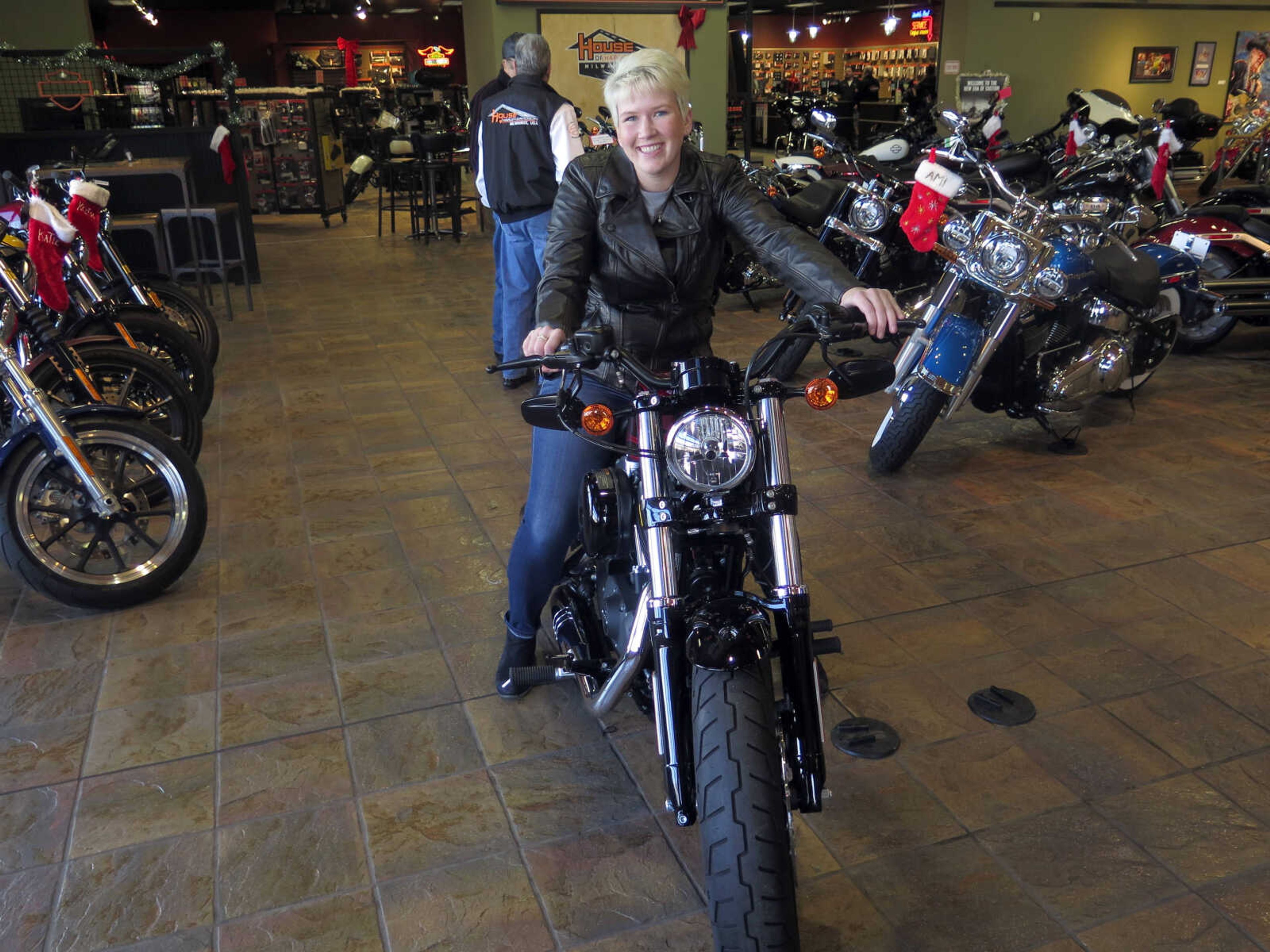 Samantha Kay poses for a photo on a 2017 Harley Sportster Forty-Eight on Dec. 12 in Milwaukee's House of Harley. Kay took a riding course at the dealership as part of Harley-Davidson's "Riding Academy," an initiative the company hopes will help bring new customers.