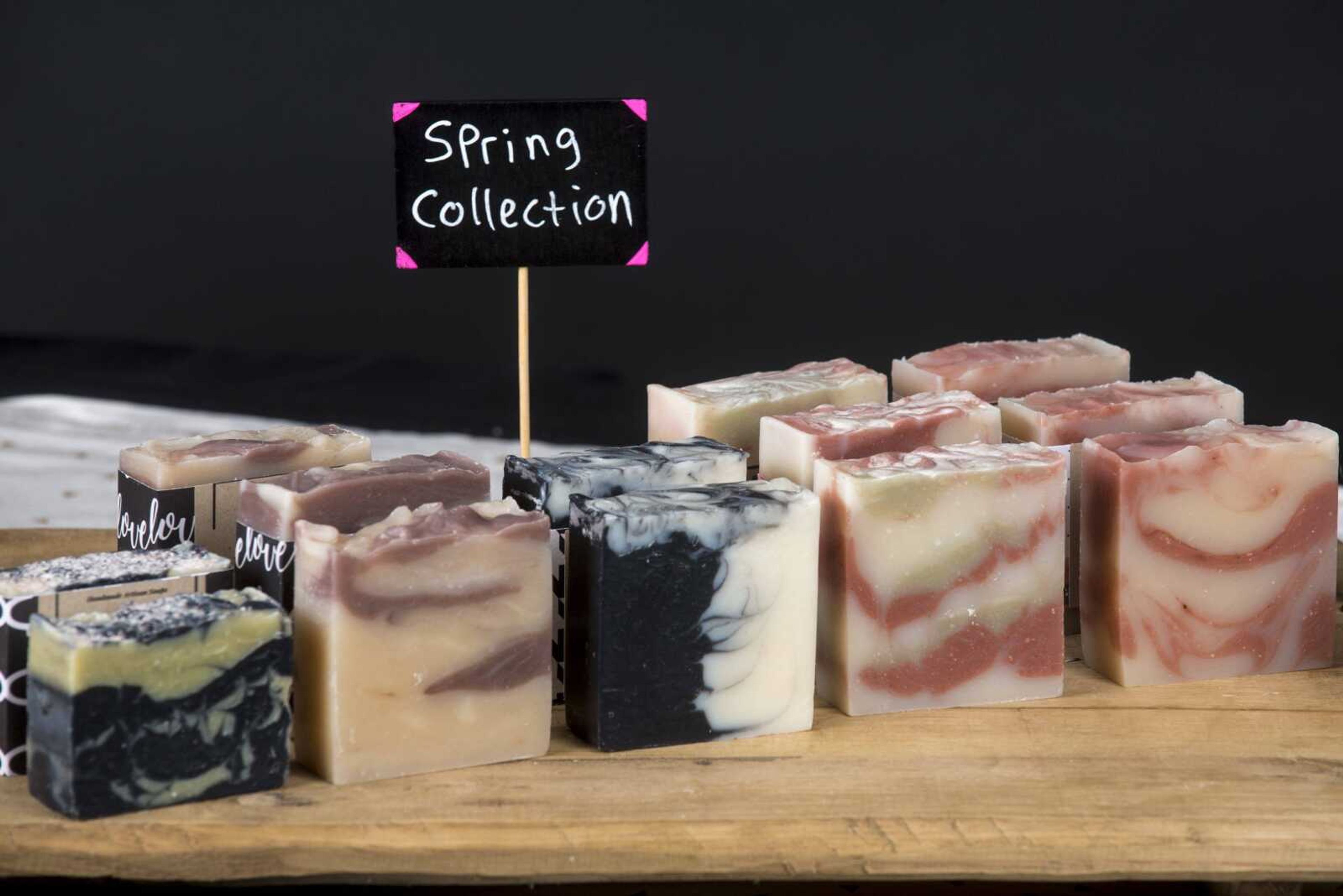 A variety of the Spring Collection homemade natural- soap products from Little Ant Soap Co. LLC is shown.