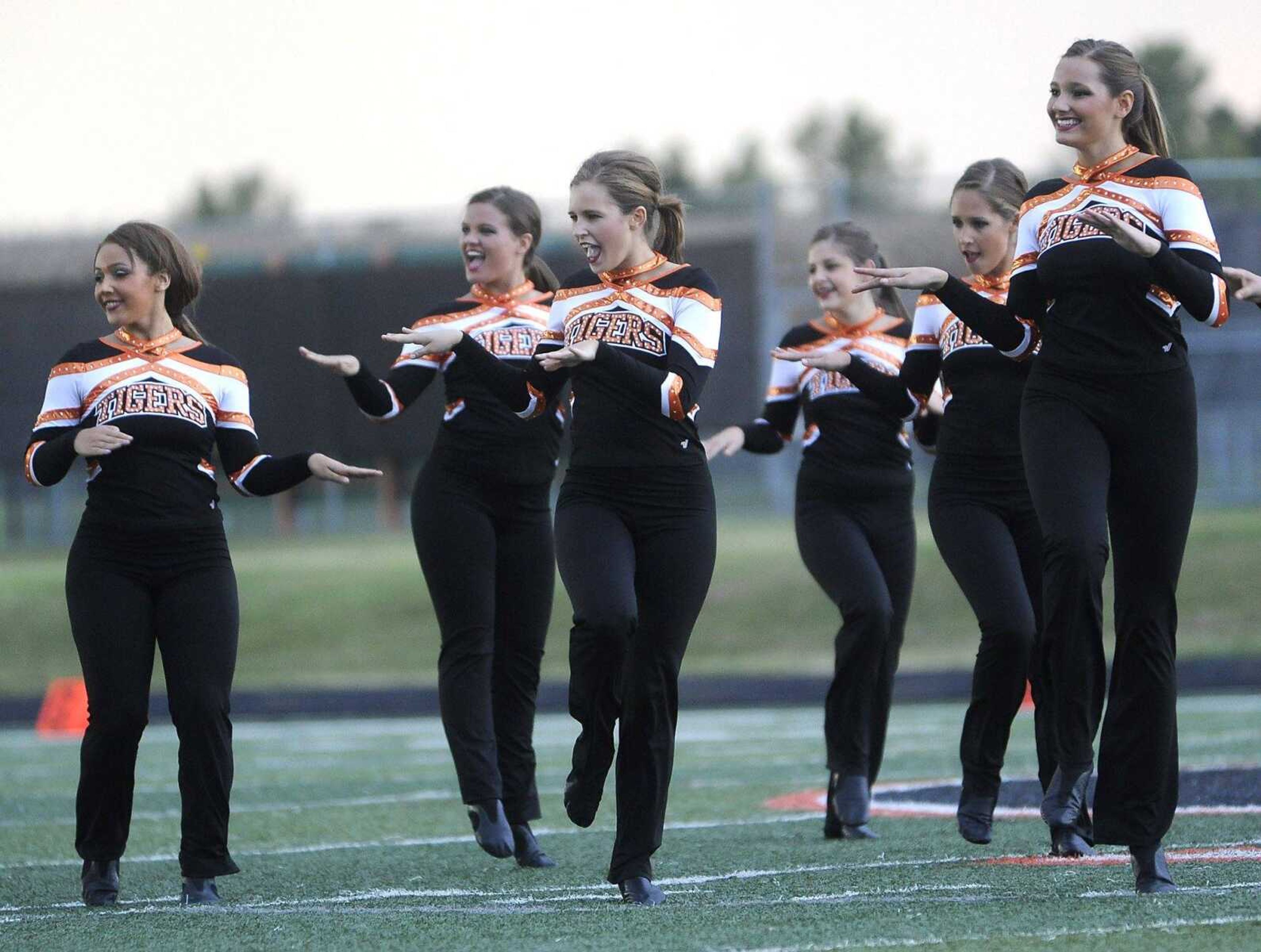 Members of the Tiger Dancers perform before the game with Poplar Bluff Friday, Sept. 11, 2015 at Central High School.