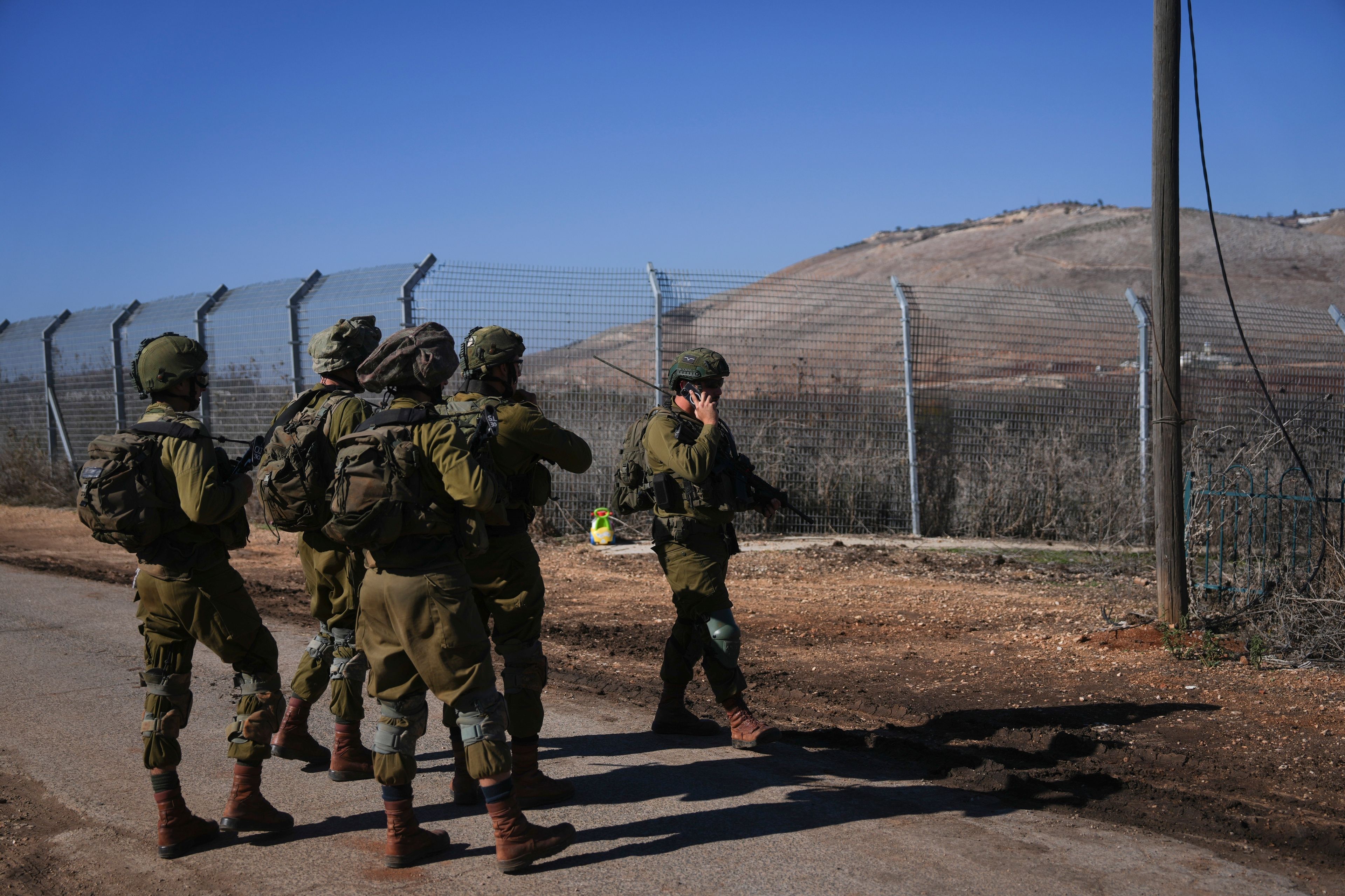 Israeli soldiers patrol the perimeter of the agricultural settlement of Avivim, next to the Lebanese border in upper Galilee, Israel, Monday Dec. 2, 2024. (AP Photo/Ohad Zwigenberg)