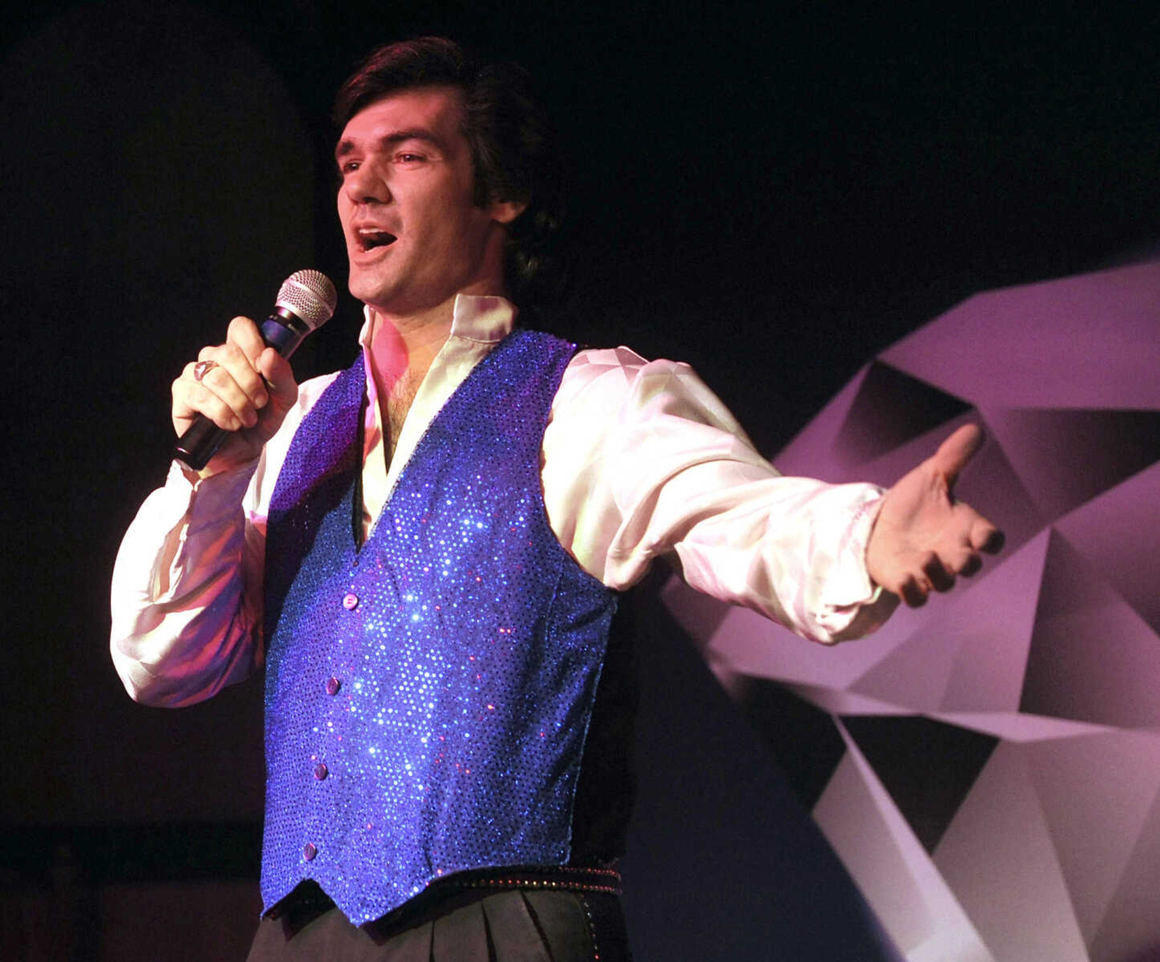 FRED LYNCH ~ flynch@semissourian.com
Keith Allynn sings "Sweet Caroline," a Neil Diamond hit from 1968, as he presents his Neil Diamond tribute show from Branson, Mo. to a dinner audience Friday, Dec. 29, 2012 at Port Cape Girardeau's River City Yacht Club.