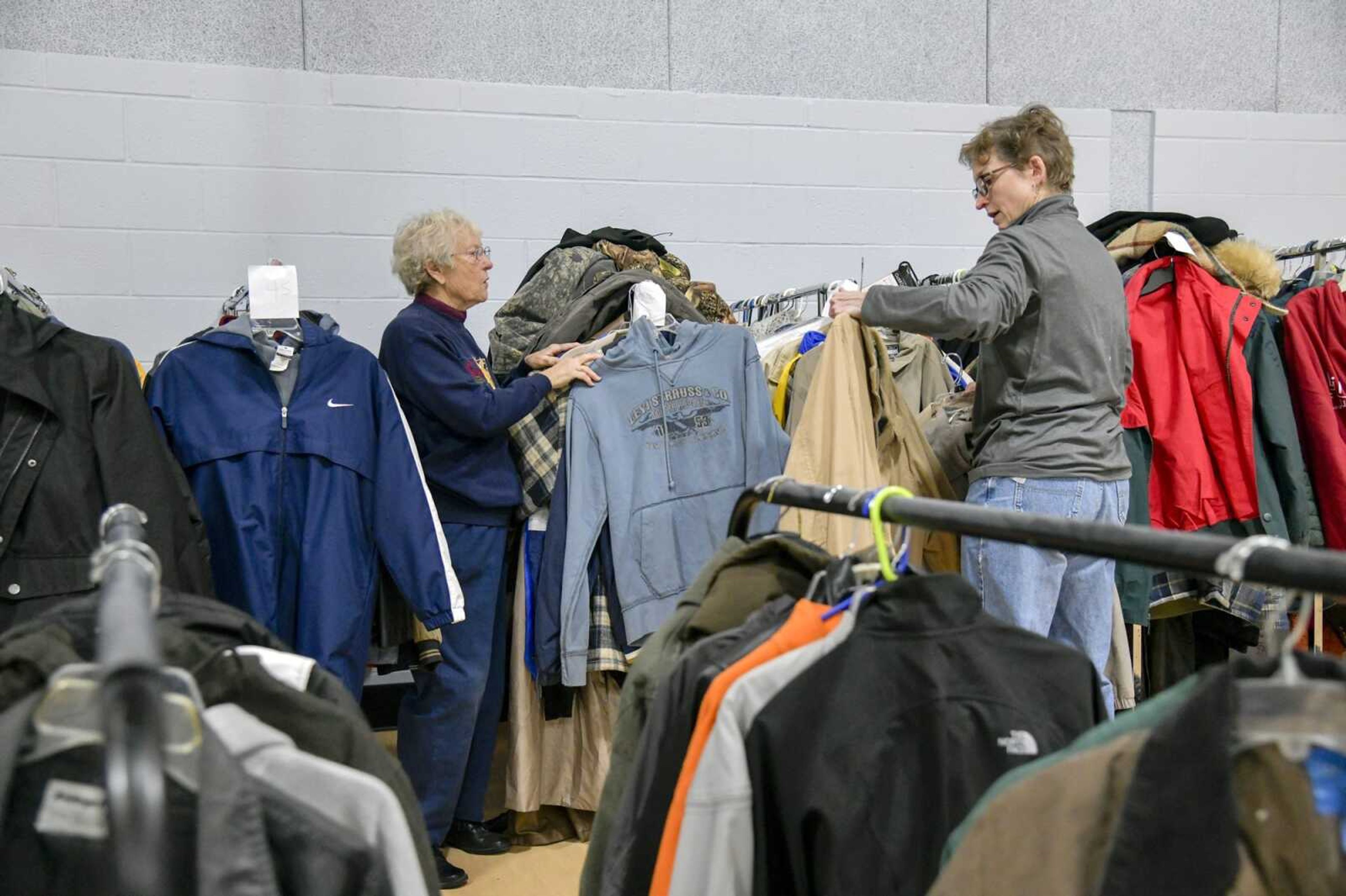 Volunteers Ethel Mize and Dana Schwieger organize donated coats by size Tuesday at the Cape Girardeau Salvation Army, 701 Good Hope St. Coats will be available for those attending the Salvation Army's free Thanksgiving meal from 11 a.m. to 1 p.m. Thursday.