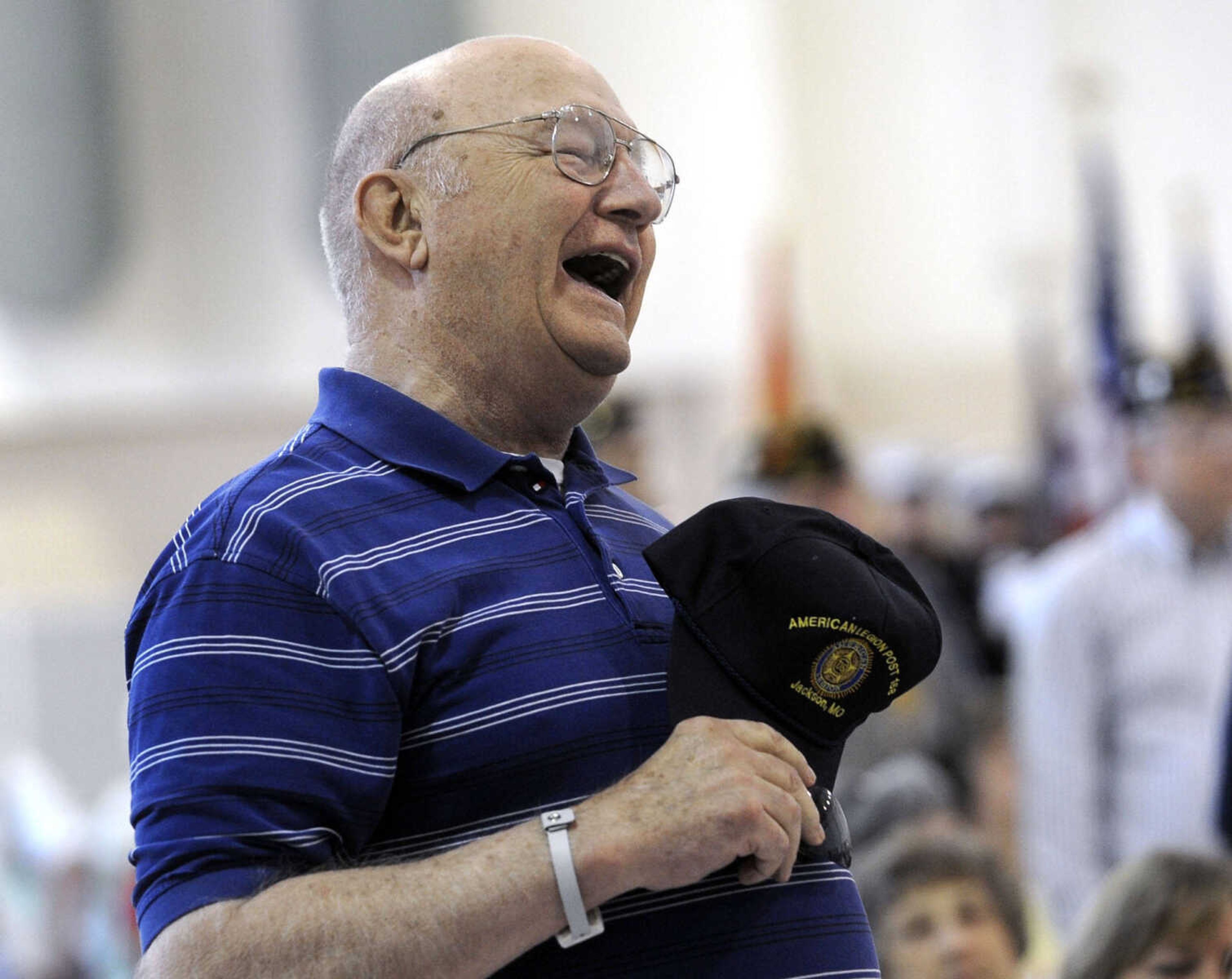 FRED LYNCH ~ flynch@semissourian.com
Navy veteran Kenny Geringer stands as "Anchors Aweigh" is played by the Cape Girardeau Municipal Band during the Armed Forces Salute at the Memorial Day service Monday, May 27, 2013 at the Osage Centre.