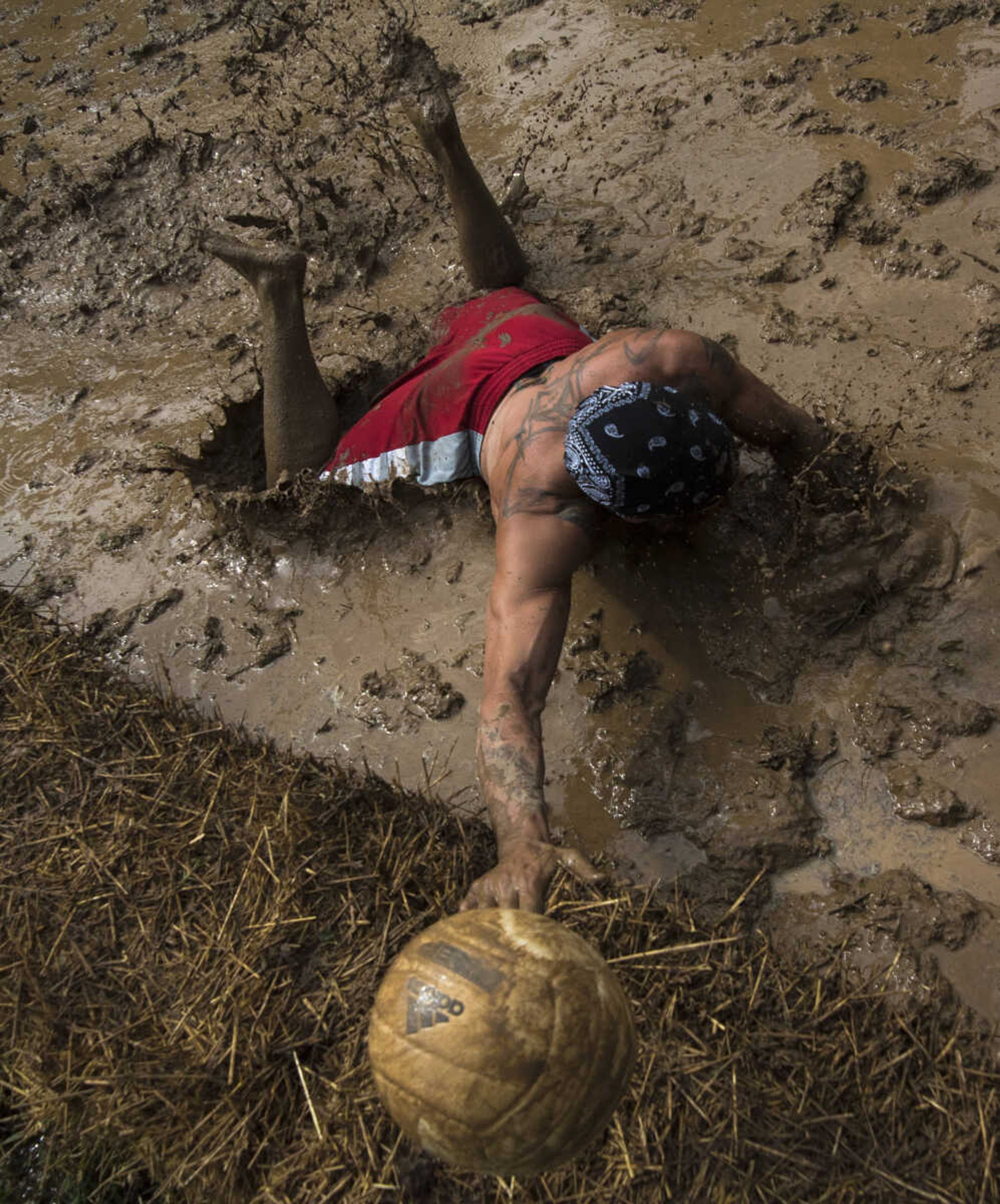 Jimmy Sievers dives for the ball during mud volleyball for the Jackson Parks and Recreation's July 4th celebration Tuesday, July 4, 2017 in Jackson City Park.