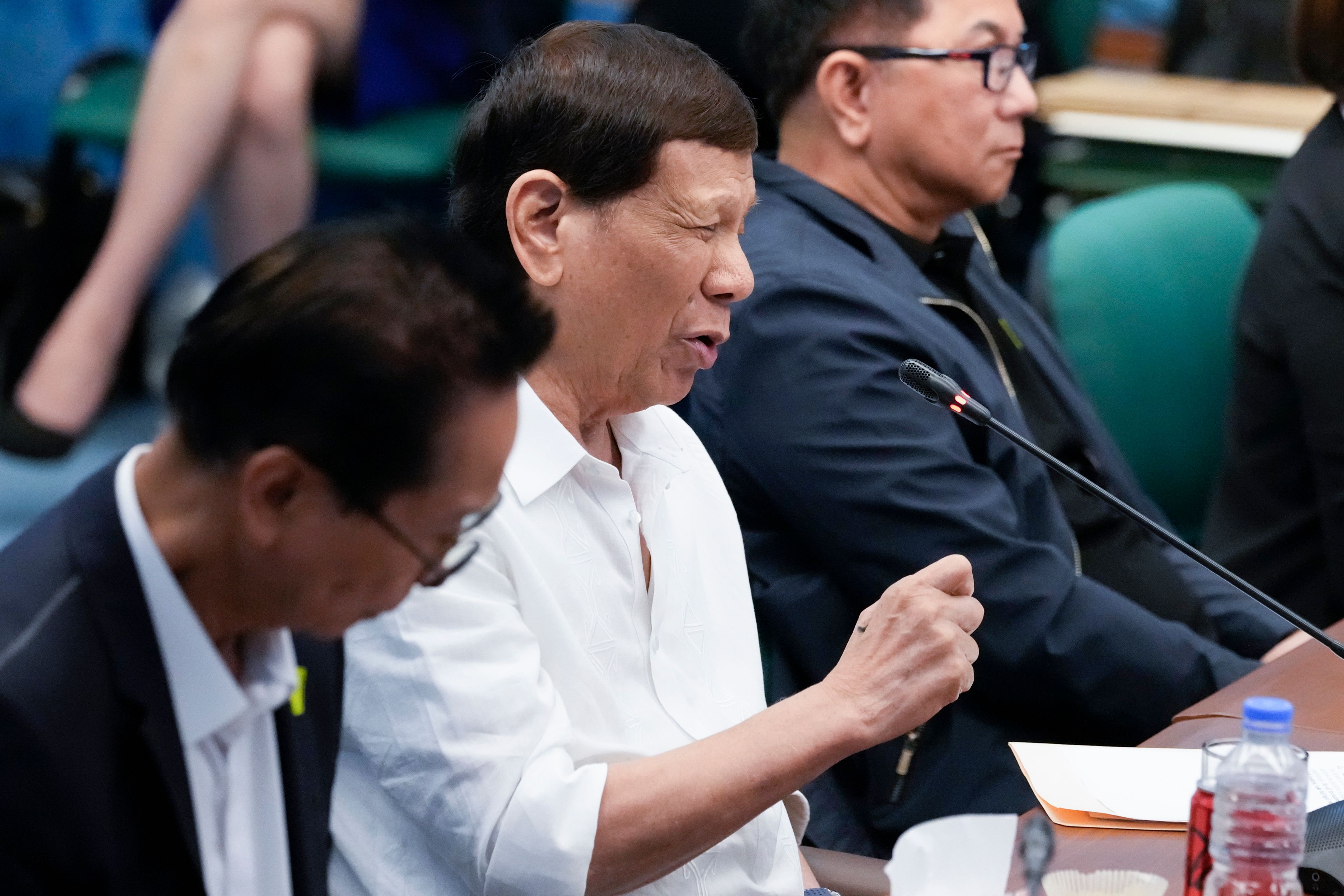 Former Philippine President Rodrigo Duterte gestures during a Senate investigation on the war on the drugs during his administration at the Philippine Senate, Monday, Oct. 28, 2024, in Manila, Philippines. (AP Photo/Aaron Favila)