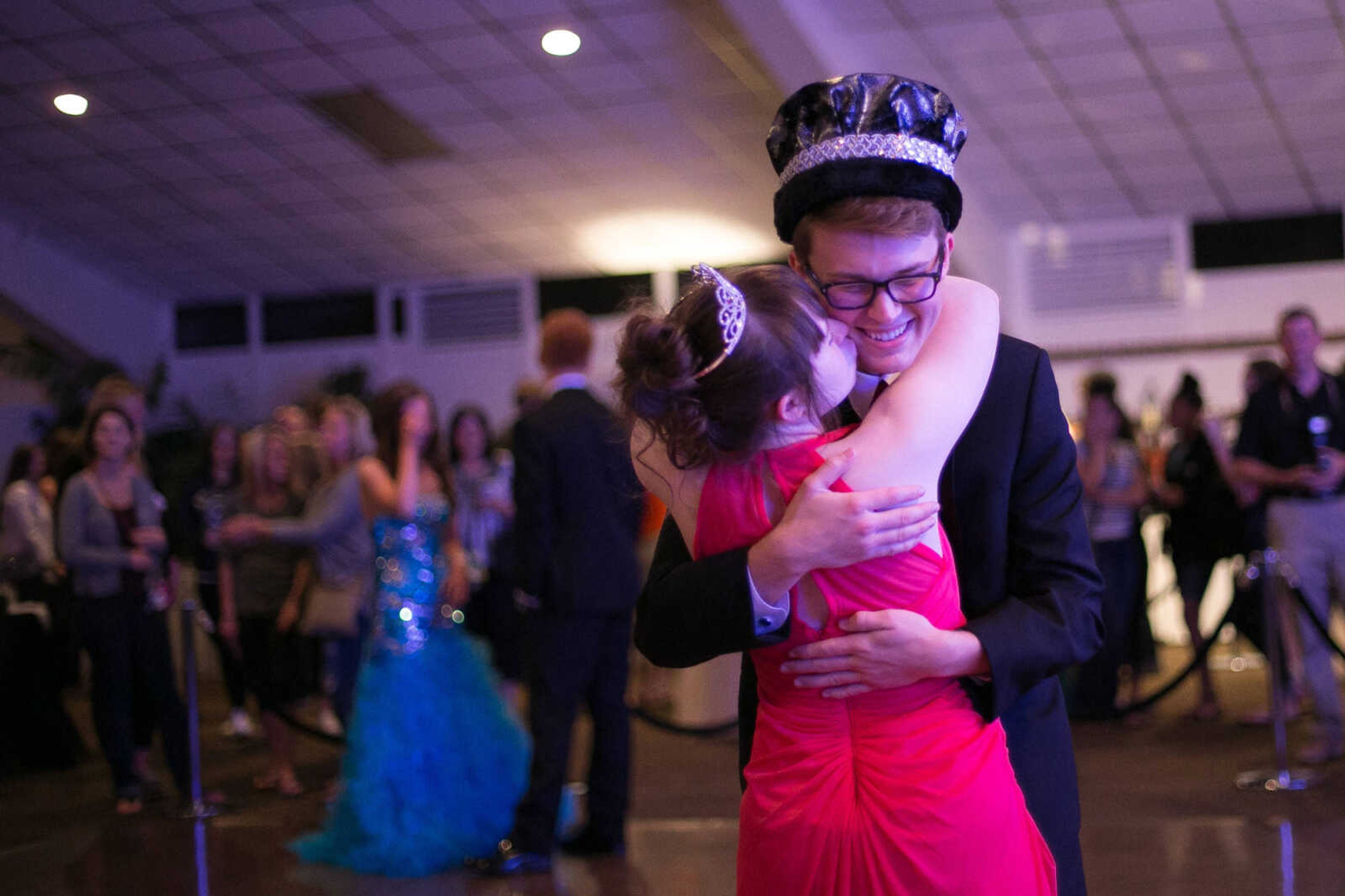 GLENN LANDBERG ~ glandberg@semissourian.com

Carley House kisses Ryan May on the cheek during their first dance after being crowned prom king and queen at the Cape Central High School prom Saturday April 25, 2015.