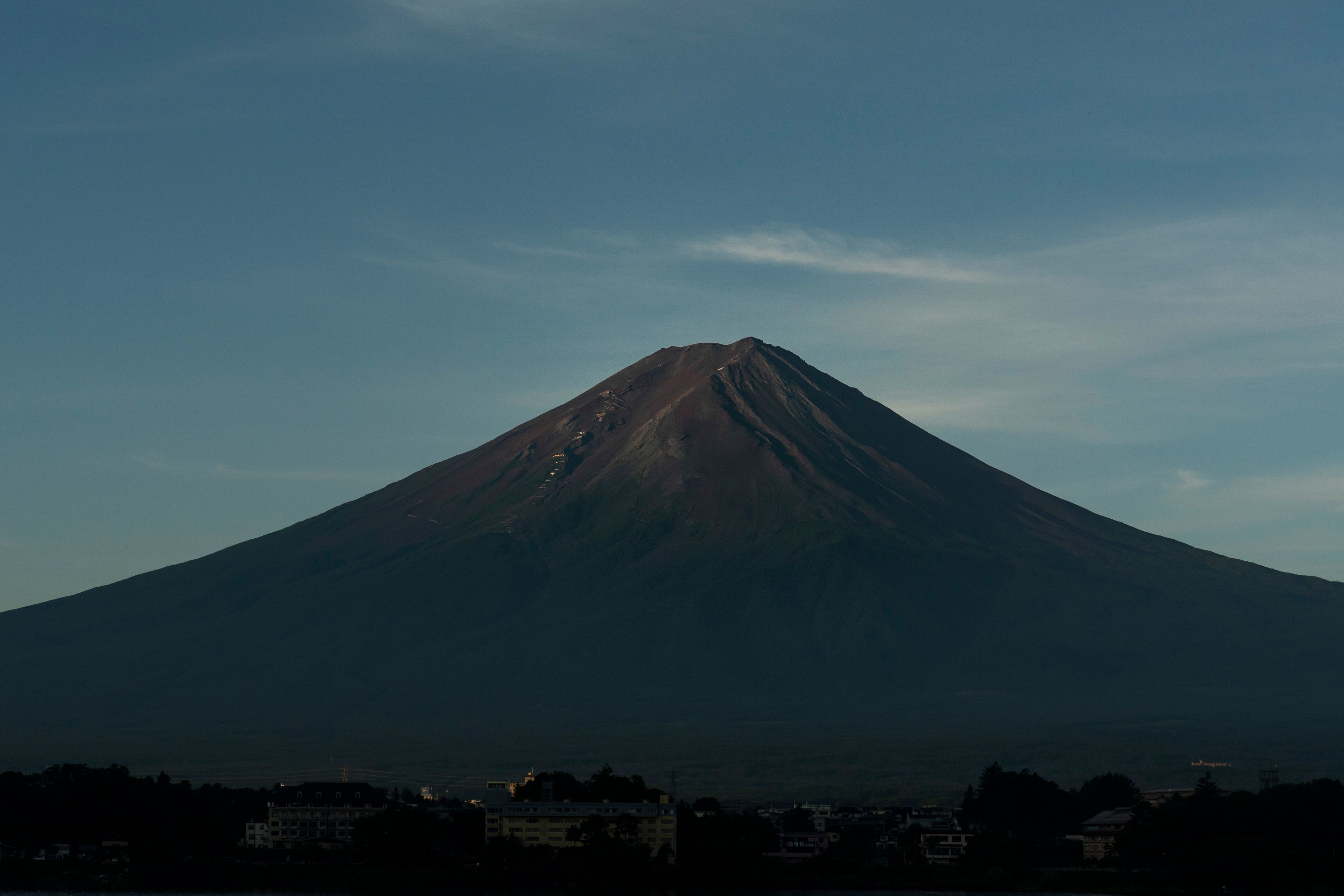 Mount Fuji is still without its iconic snowcap for the first time in 130 years