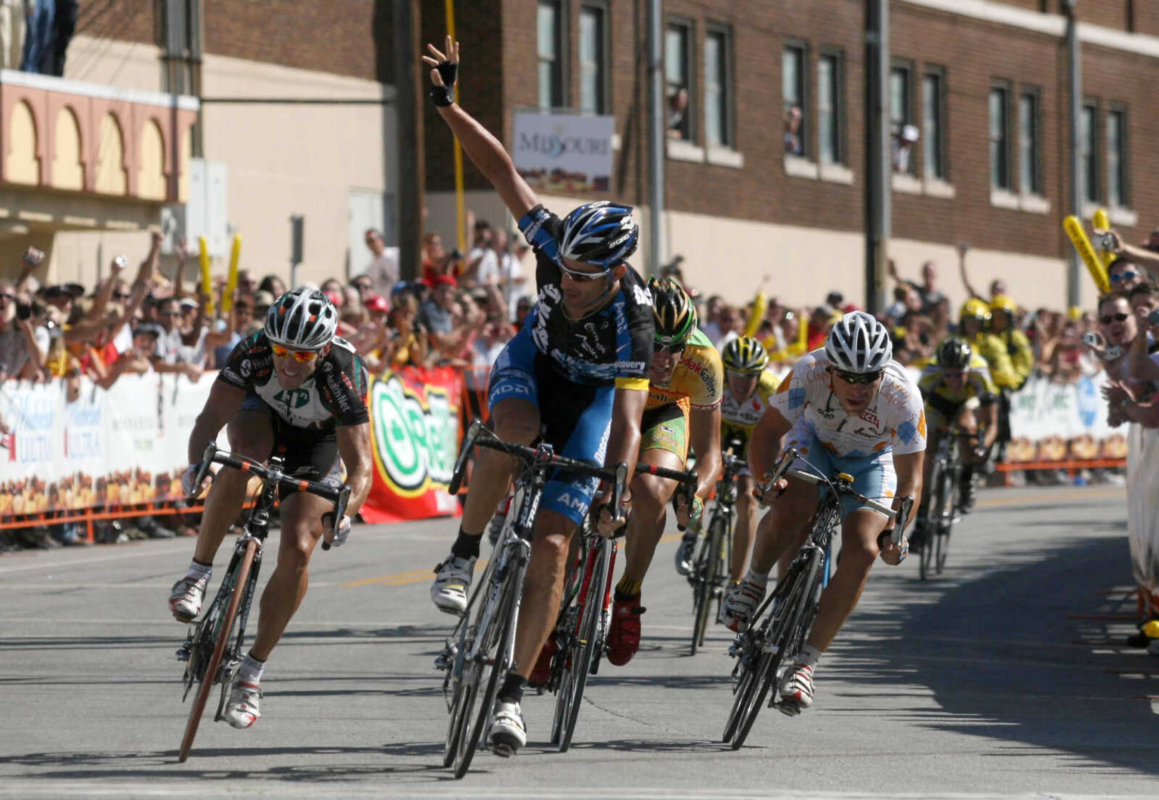 Team Discovery's George Hincapie, center, crosses the finish line just ahead of several challengers at the end of the second stage of the Tour of Missouri in downtown Springfield, Mo., Wednesday, Sept. 12, 2007. (AP Photo/Mark Schiefelbein)