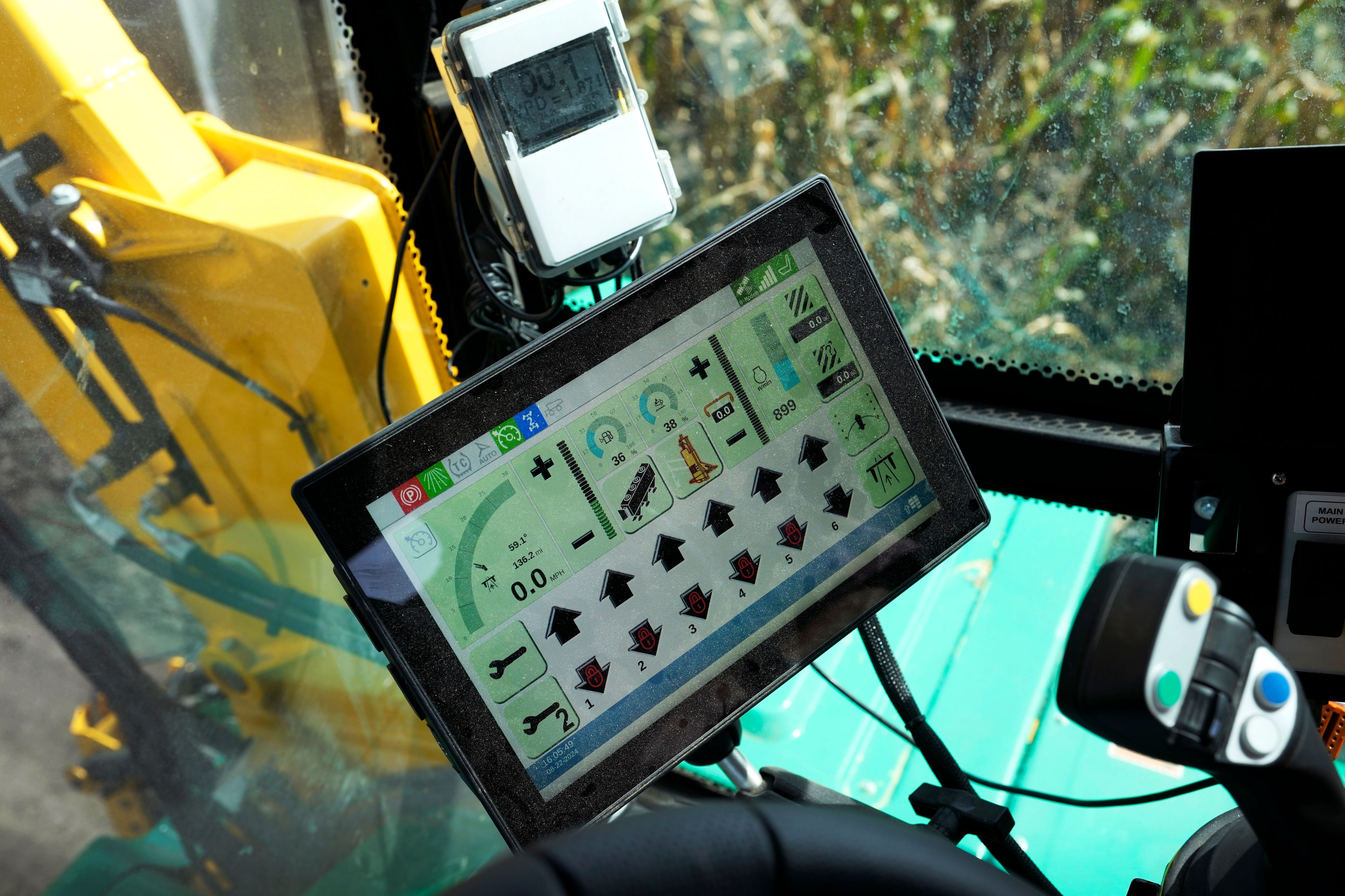 A computer screen inside a PowerPollen collector shows data after being driven through a cornfield, Thursday, Aug. 22, 2024, near Ames, Iowa. (AP Photo/Charlie Neibergall)