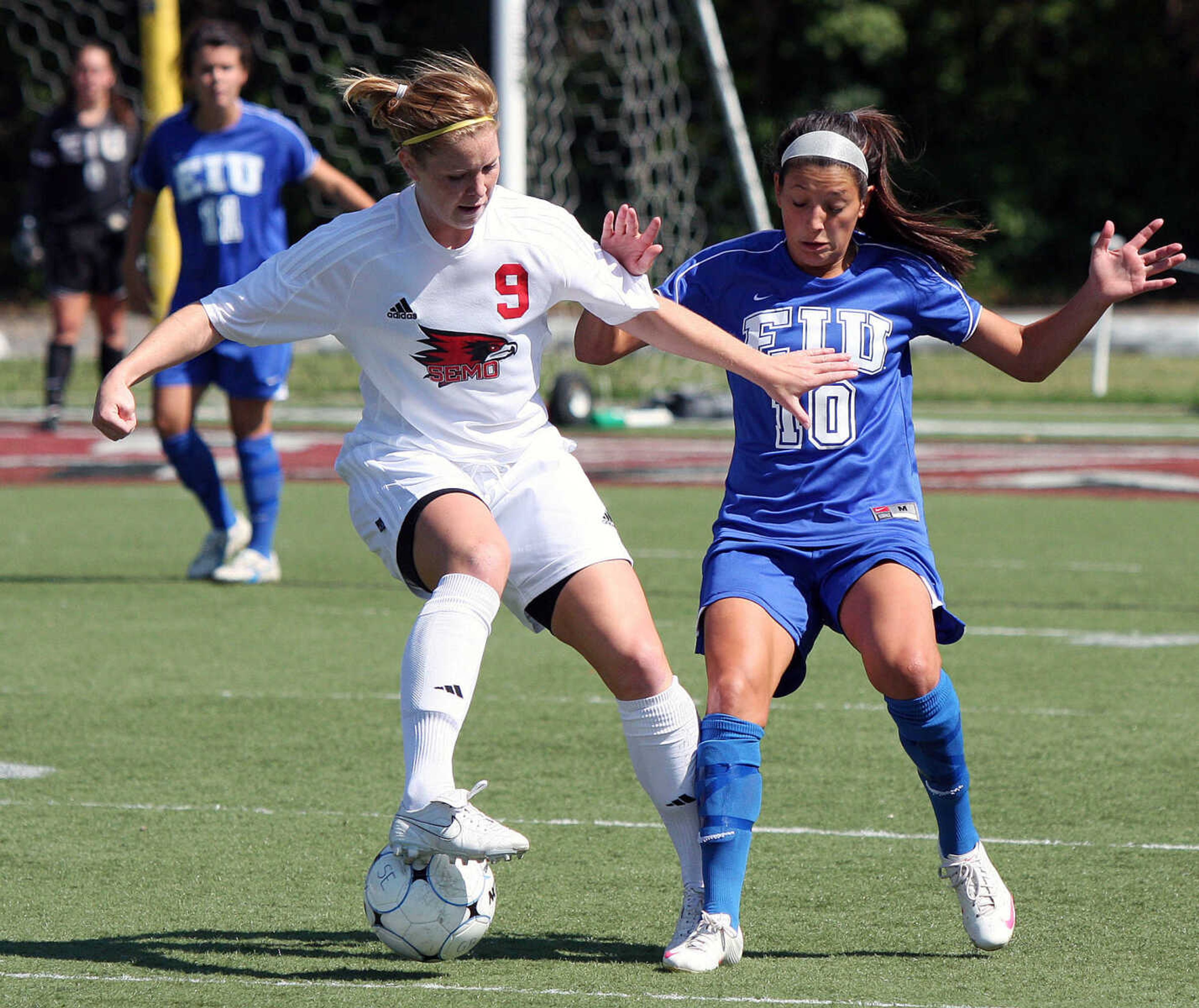 Shona Goodwin, left, displays great dribbling skills to get by Panther's defender Rachel Hamilton