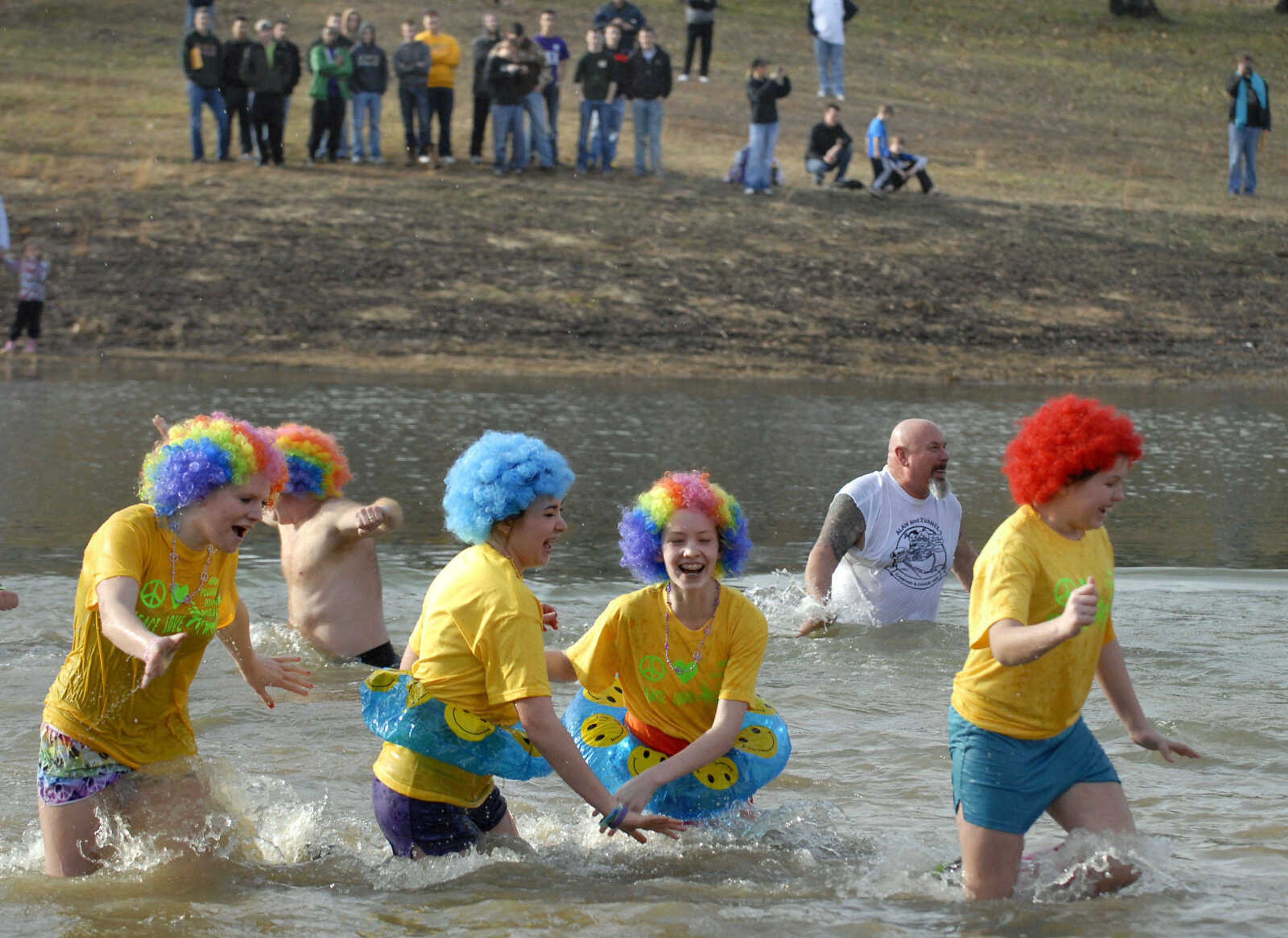 KRISTIN EBERTS ~ keberts@semissourian.com

Team Delta Bobcats head back toward dry land during the 2012 Polar Plunge at the Trail of Tears State Park's Lake Boutin on Saturday, Feb. 4, 2012.