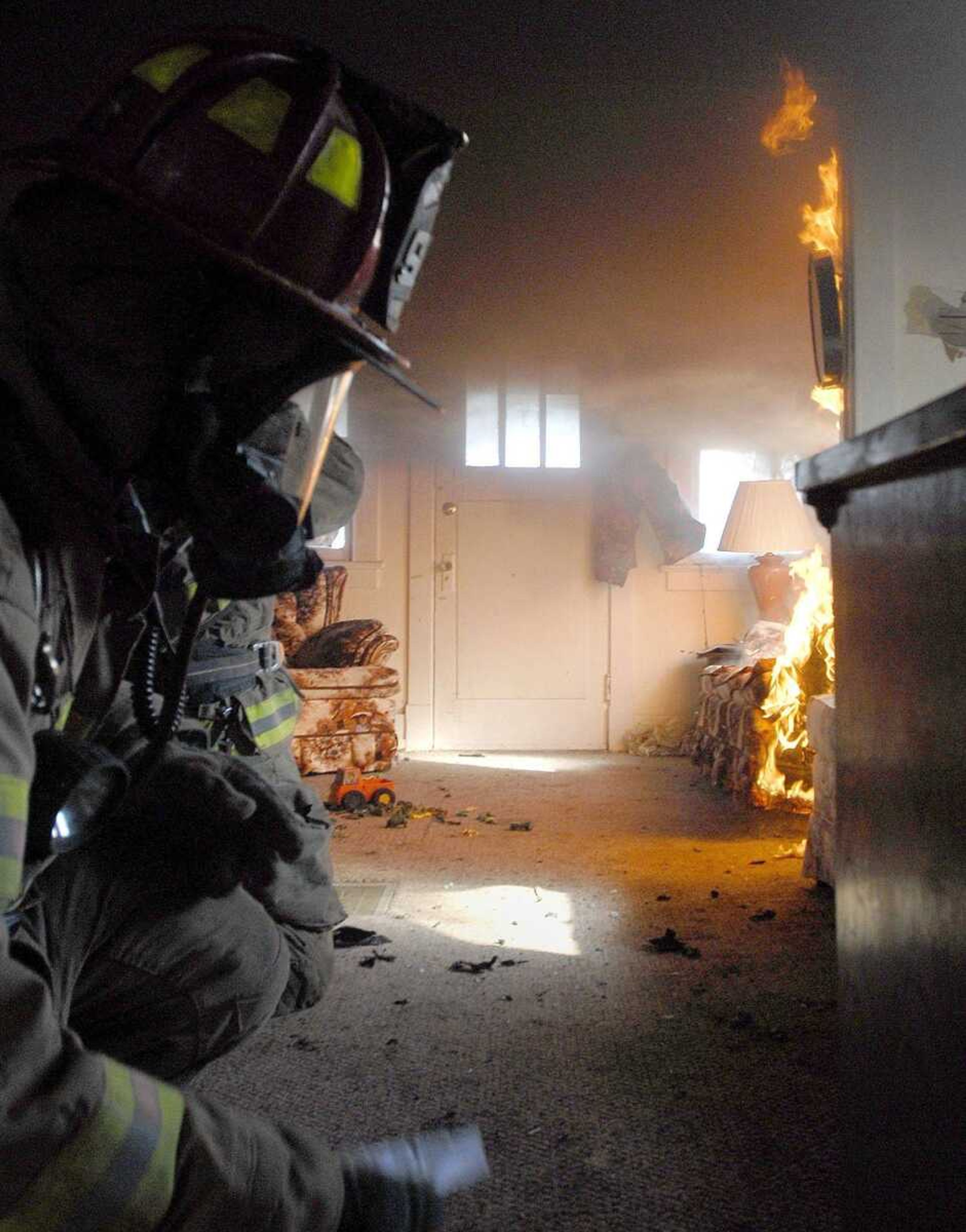 Fire crews in Cape Girardeau attacked two small house fires in the 800 block of Main Street for training purposes Thursday. (Laura Simon)