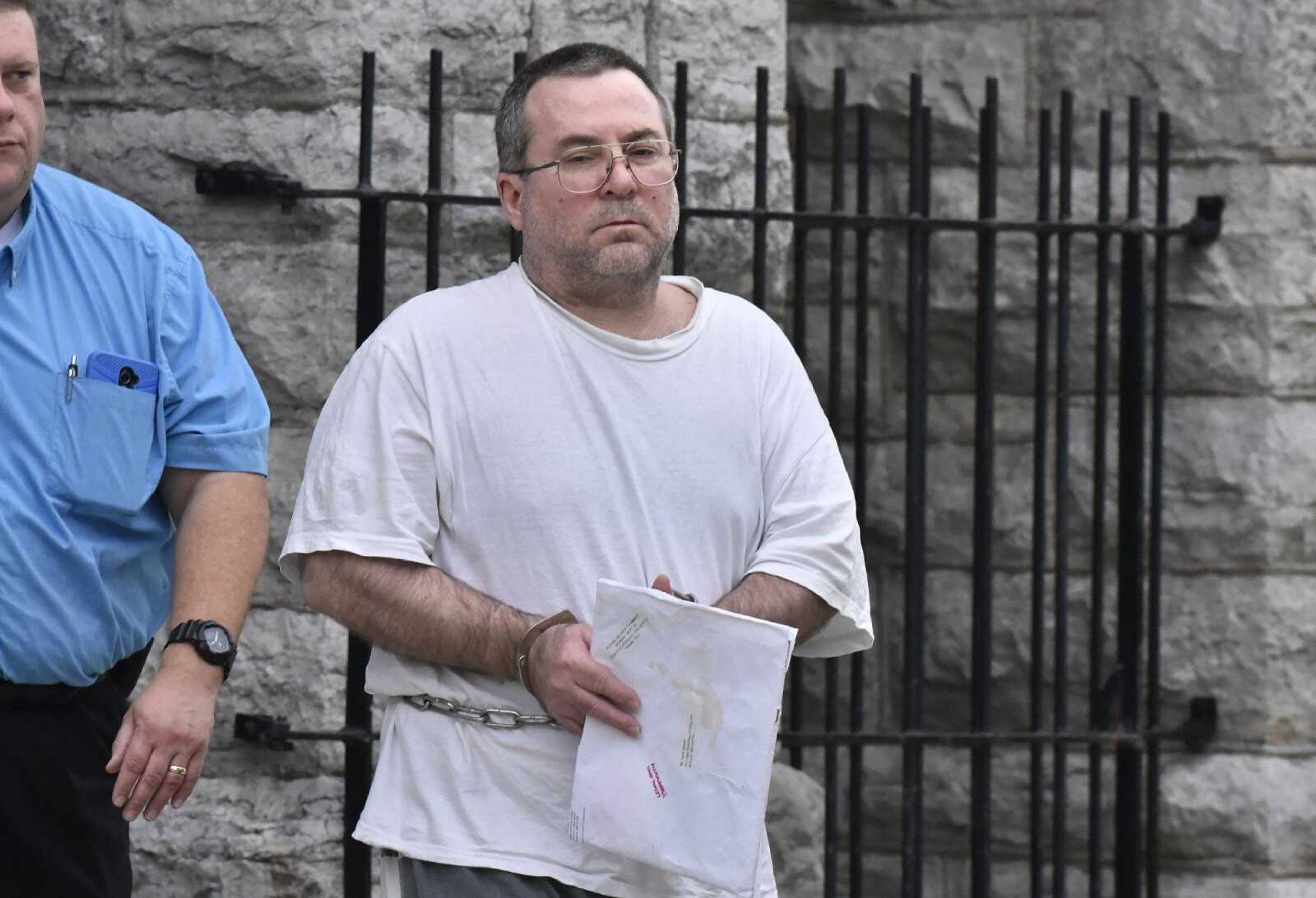 Keith Monia is escorted from the Cape Girardeau County Courthouse on Tuesday, Nov. 8, 2016, after his sentencing hearing. Monia was sentenced to two consecutive 15-year sentences on charges of financial exploitation of the elderly and stealing by deceit in Cape Girardeau County and Scott County. Monia pleaded to stealing $517,500 from nine victims.