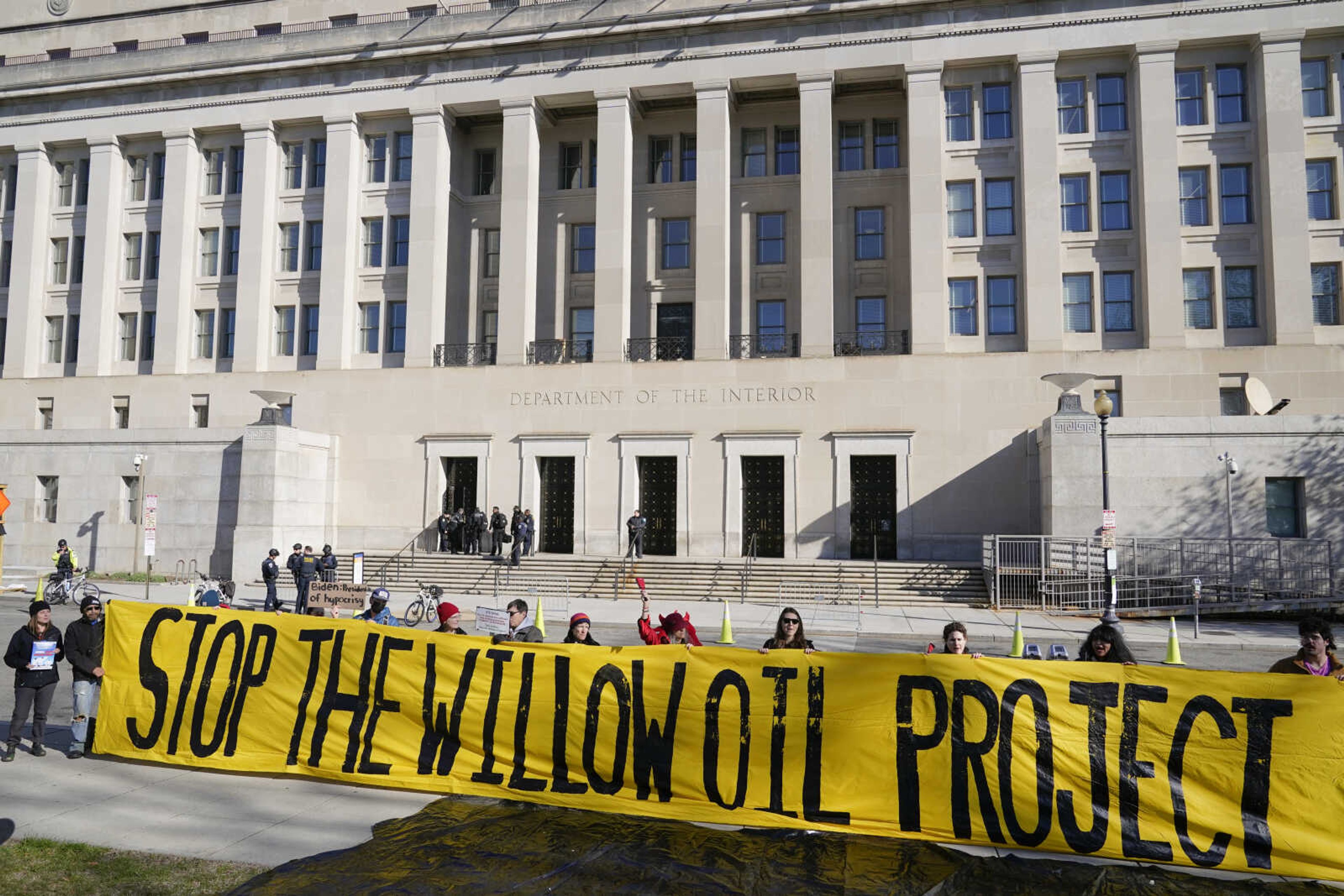 Demonstrators protest against the Biden administration's approval of the Willow oil-drilling project before a scheduled speech by President Joe Biden at the Department of the Interior on March 21 in Washington.