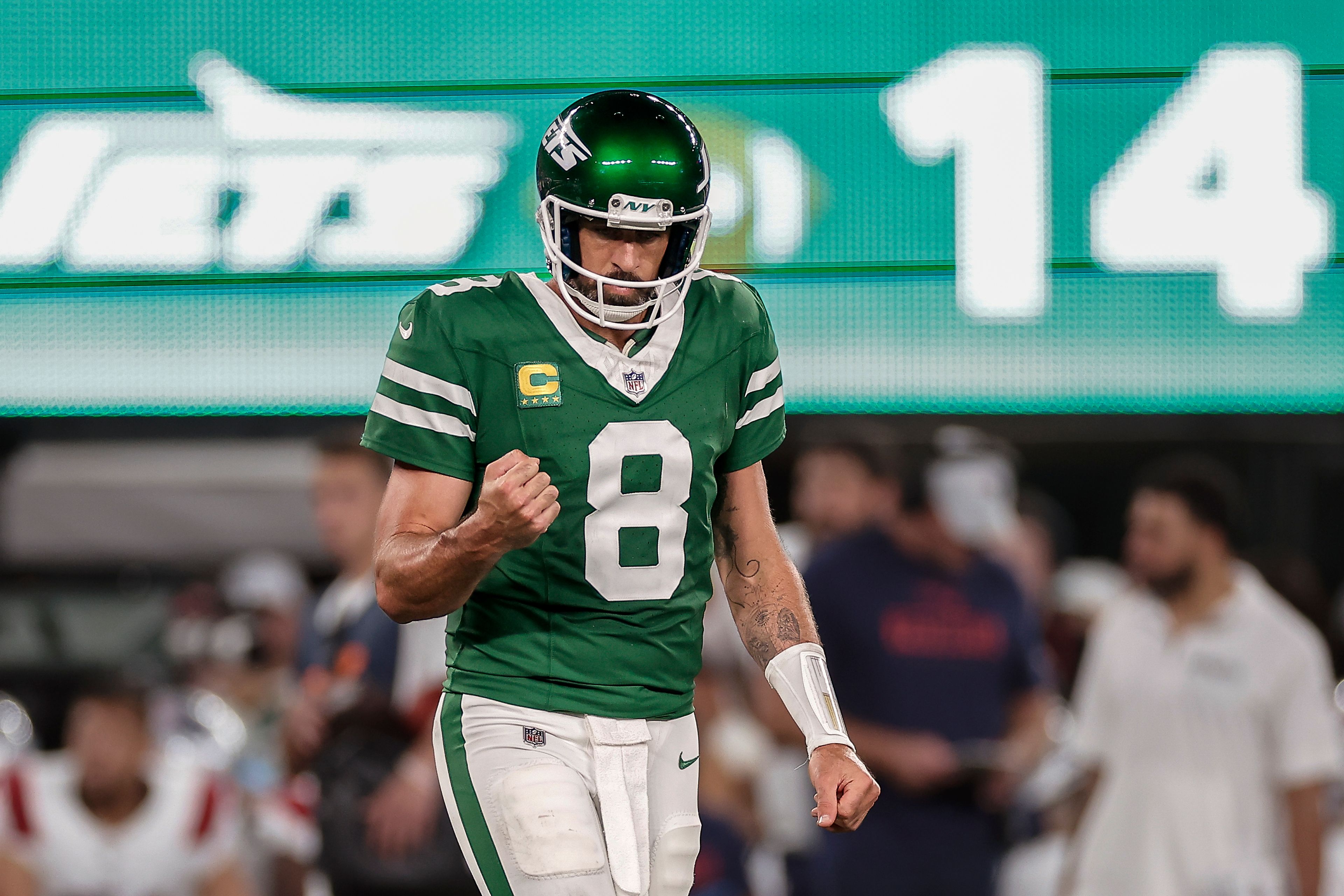 New York Jets quarterback Aaron Rodgers (8) reacts during the third quarter of an NFL football game against the New England Patriots, Thursday, Sept. 19, 2024, in East Rutherford, N.J. (AP Photo/Adam Hunger)