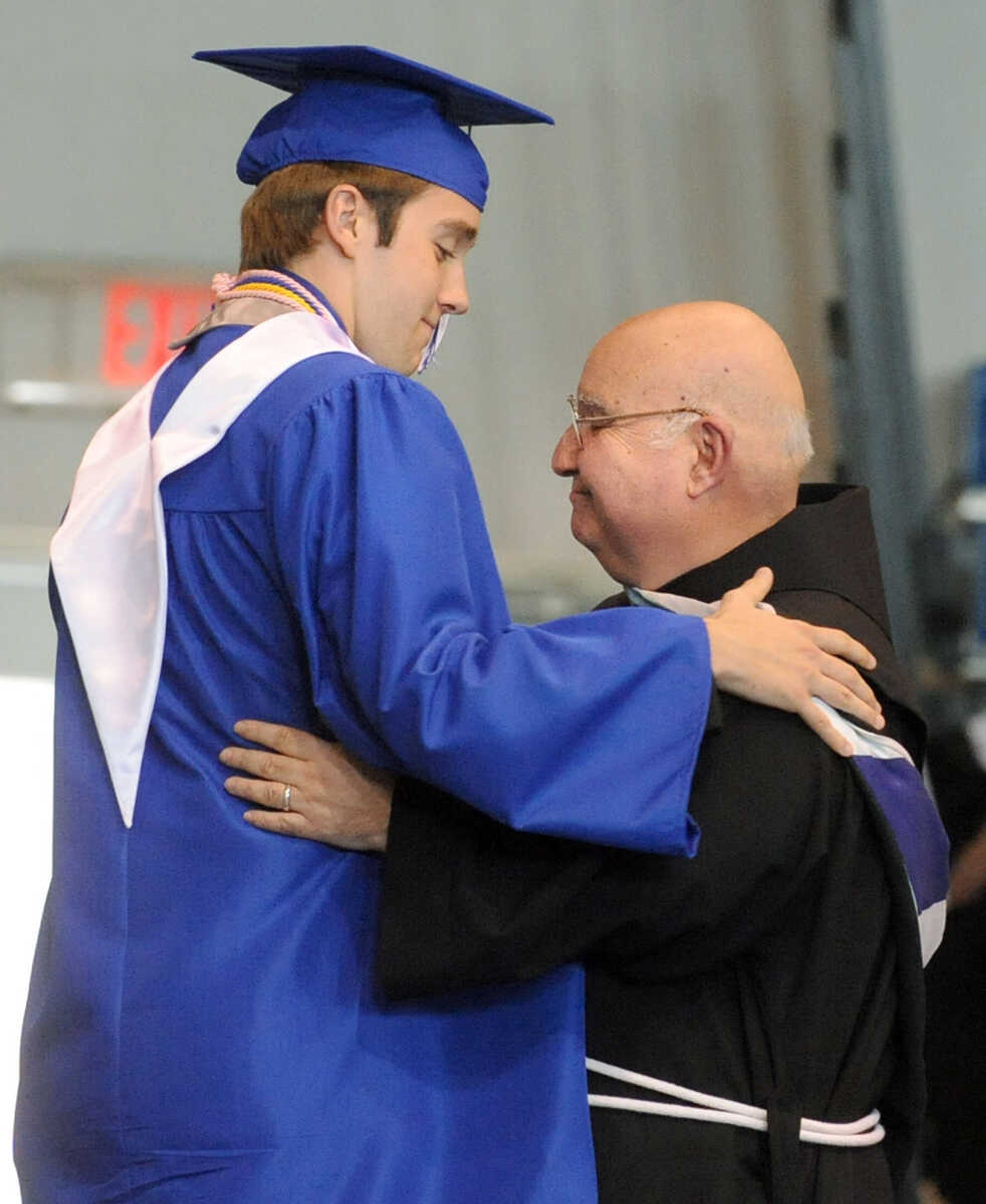 LAURA SIMON ~ lsimon@semissourian.com

Student body president Kevin Brost introduces principal Brother David Anthony Migliorino, O.S.F., Sunday, May 19, 2013, during Notre Dame Regional High School commencement in Cape Girardeau..