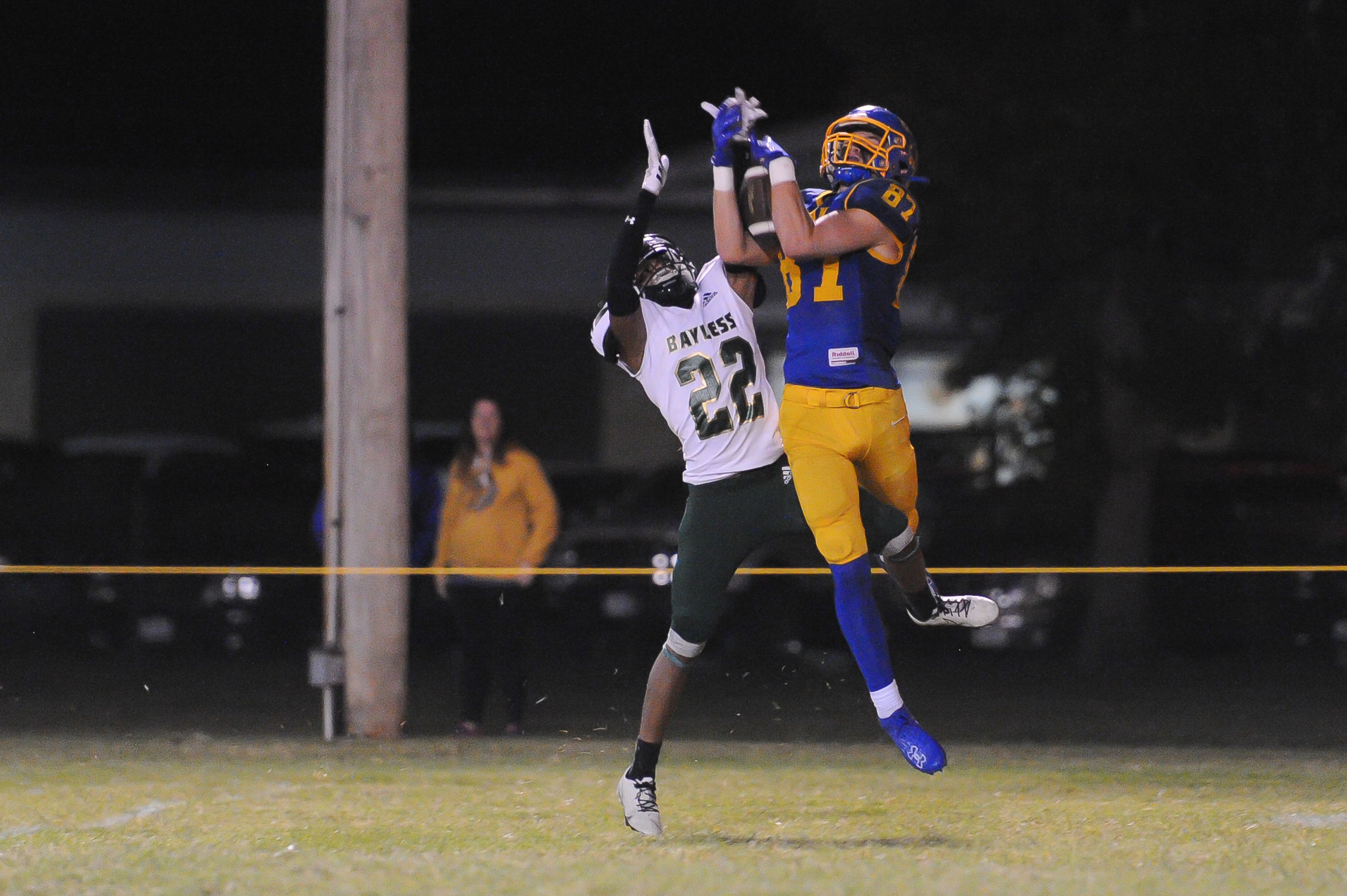 St. Vincent's Max Wheeler (right) hauls in a deep ball during a Friday, October 4, 2024 game between the St. Vincent Indians and the Bayless Bronchos at St. Vincent High School in Perryville, Mo. St. Vincent defeated Bayless, 56-21.