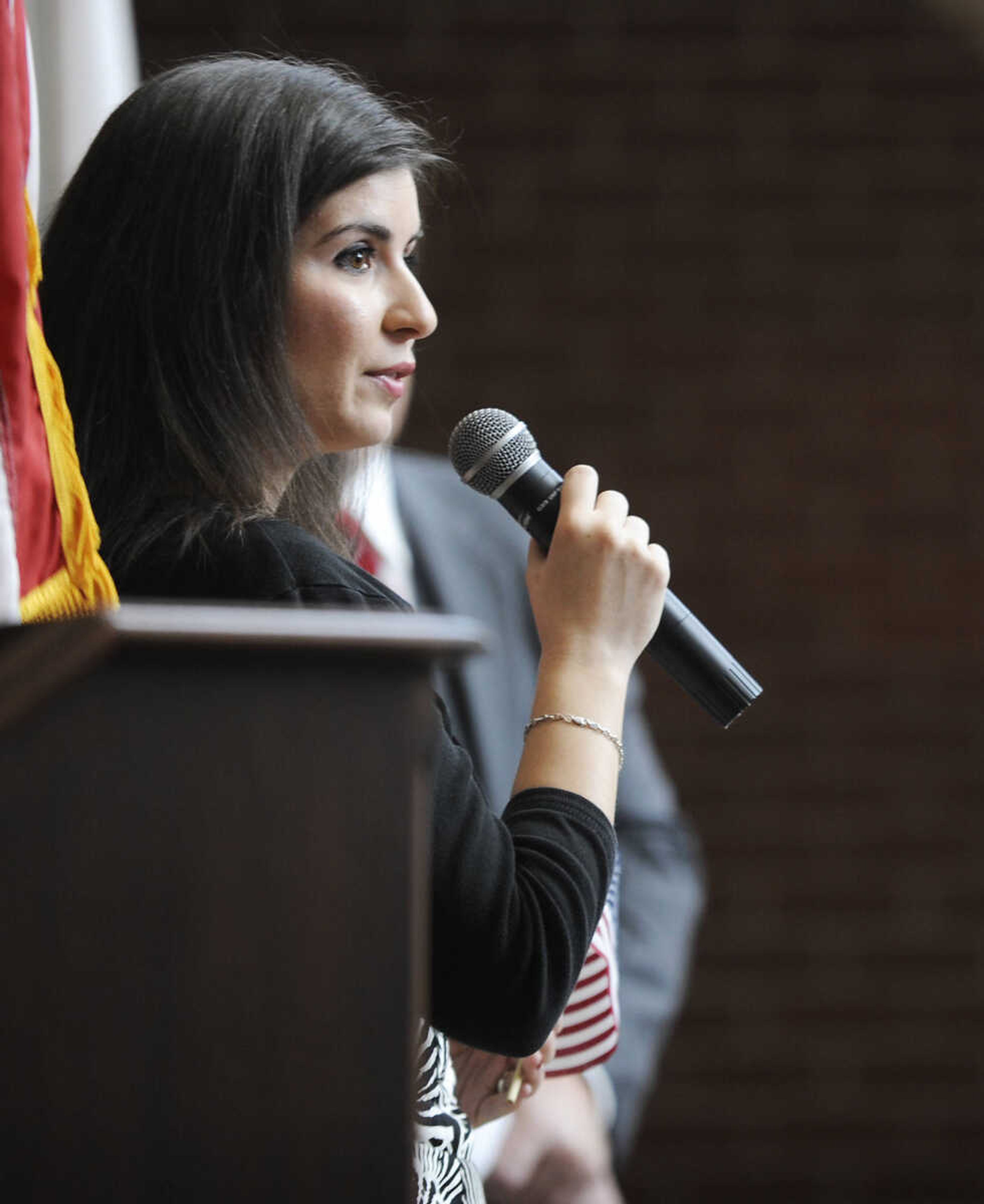 Nicoleta Andreea Bollinger, who immigrated to the U.S. from Romania, speaks about becoming a U.S. citizen during a naturalization ceremony Wednesday, May 1, at the Rush H. Limbaugh Sr. U.S. Courthouse in Cape Girardeau. Bollinger was one of 29 people from 11 countries who were administered the Oath of Allegiance, making them U.S. citizens, by U.S. District Court Judge Stephen N. Limbaugh Jr. during the ceremony.