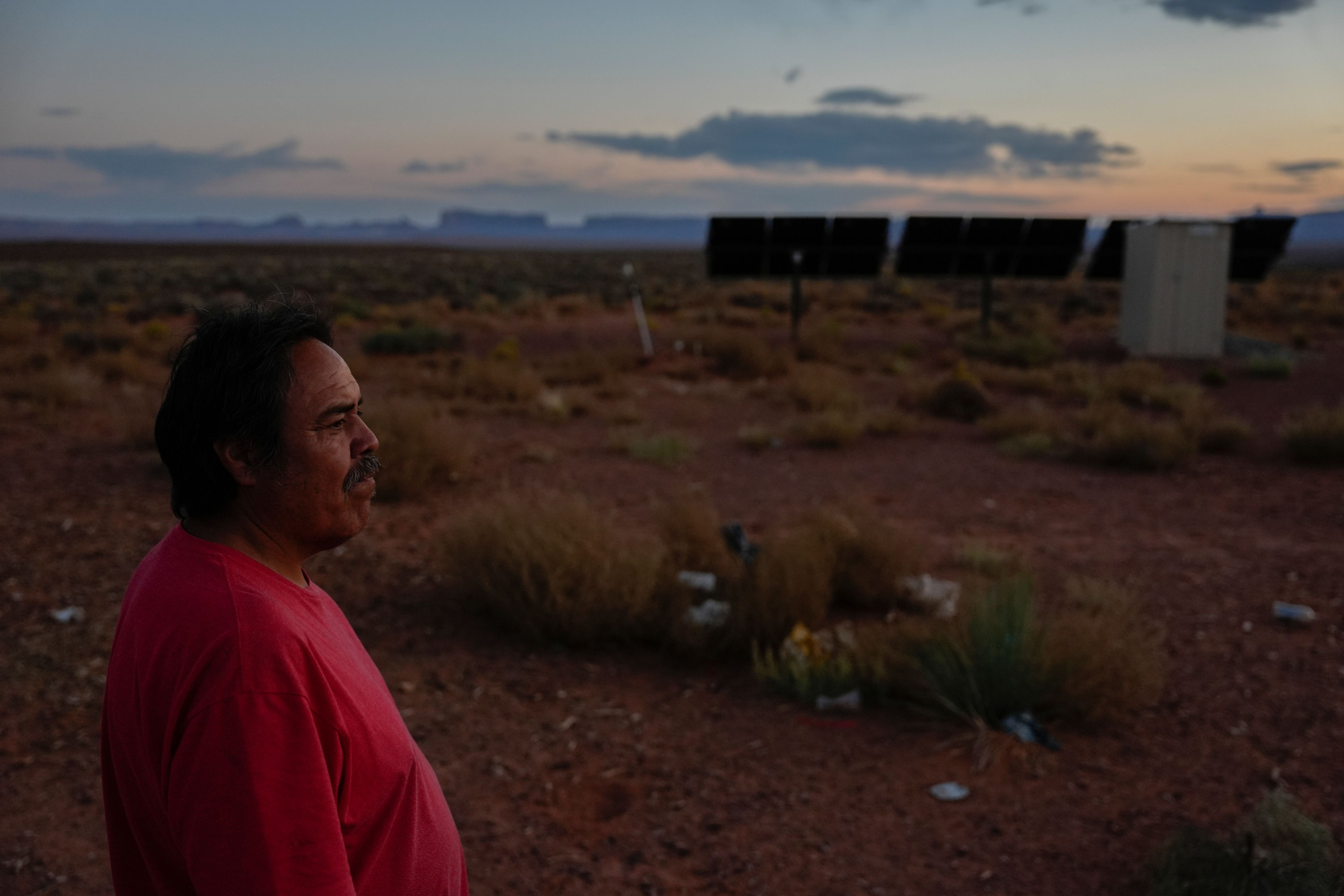 Ricky Gillis looks at the sunset, Tuesday, Oct. 8, 2024, at his home on the Navajo Nation in Halchita, Utah. (AP Photo/Joshua A. Bickel)