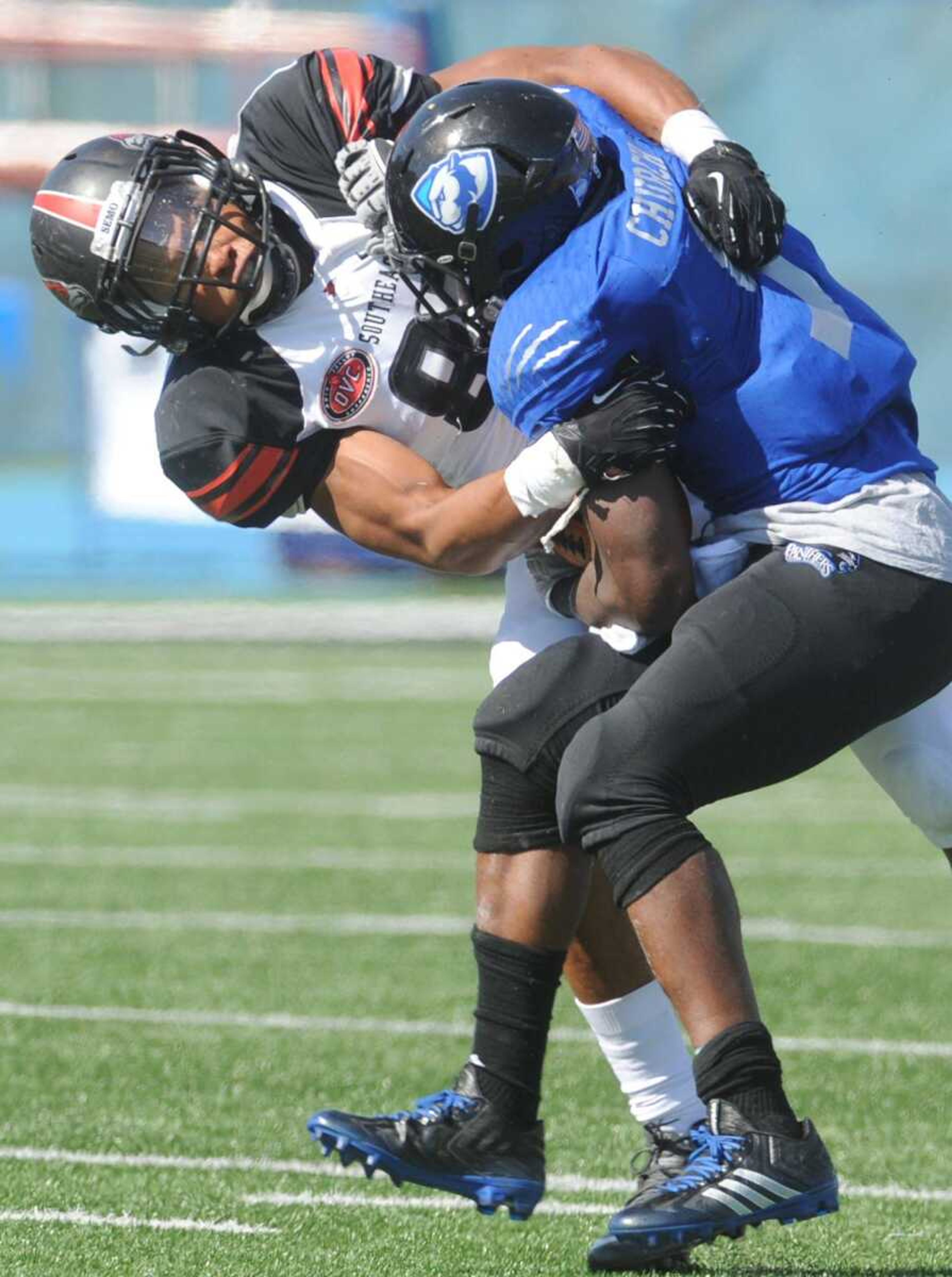 Southeast Missouri State's Kendall Donnerson wraps up Eastern Illinois  Devin Church during the second quarter Saturday, Oct. 10, 2015 in Charleston, Illinois. (Fred Lynch)