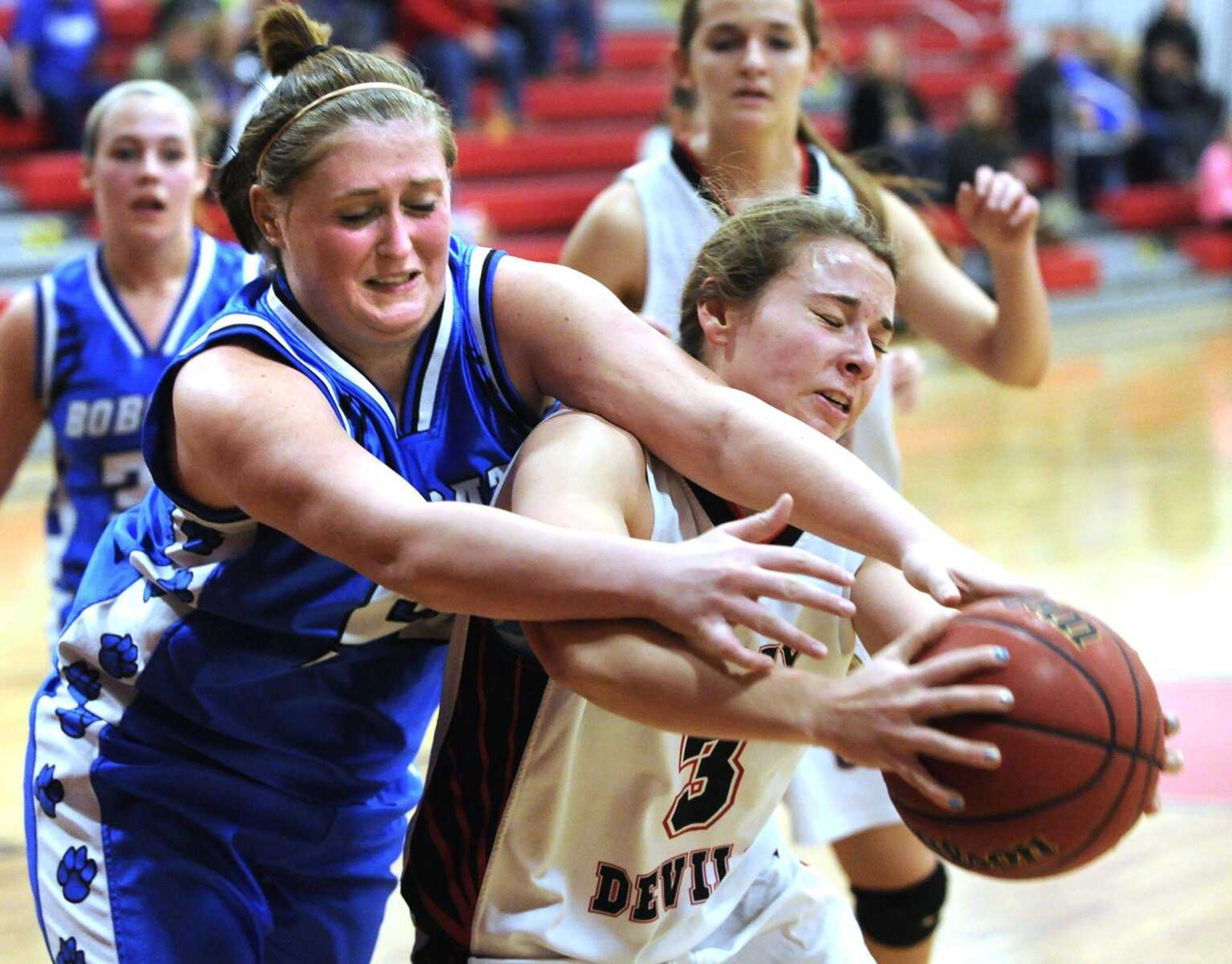 Delta's Kiley Wicker, left, challenges Chaffee's Julia Sutterfield for a rebound during the second quarter of a first-round game in the Scott-Mississippi Conference Tournament on Tuesday in Chaffee, Missouri. (Fred Lynch)