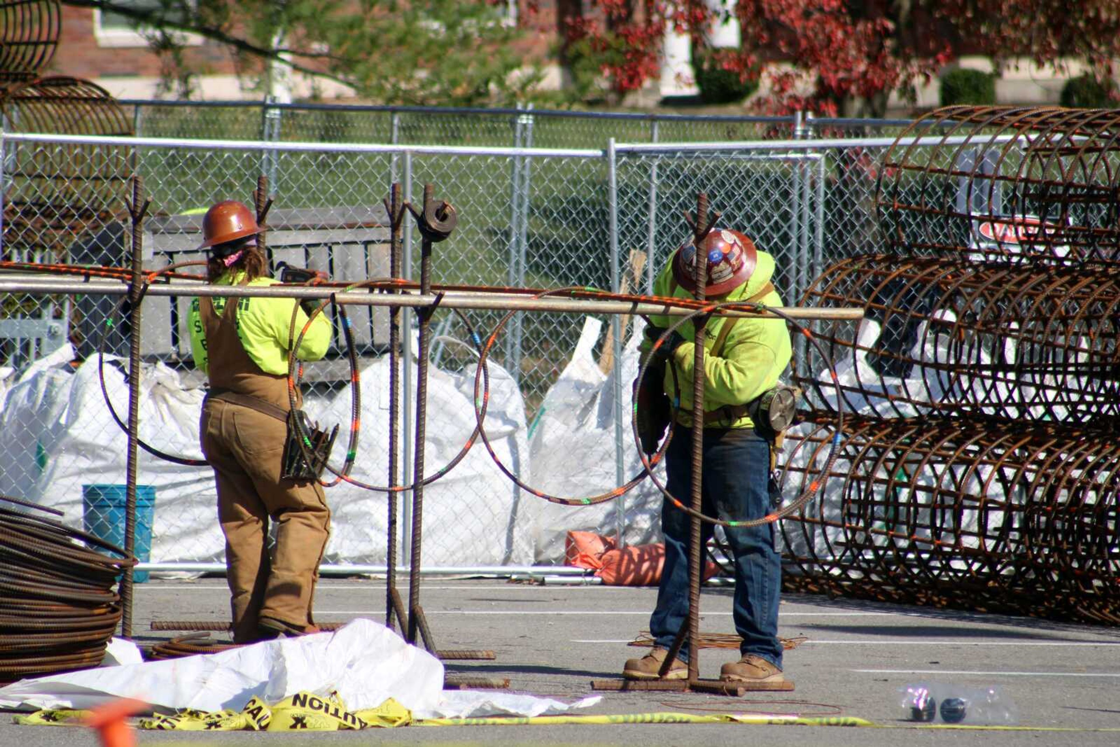 Ameren Missouri employees continue construction on  Southeast Missouri Neighborhood Solar Center on Wednesday in the Show Me Center parking lot in Cape Girardeau.