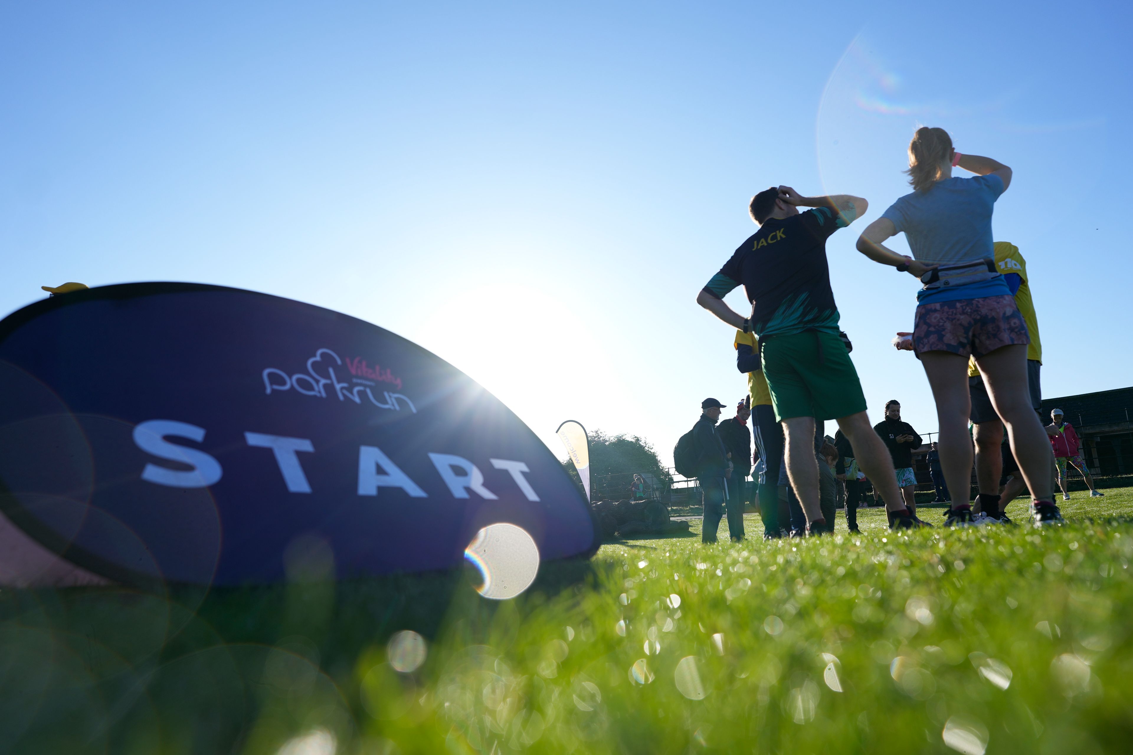 Competitors wait near the start of the parkrun event in Bushy Park, southwest London, Saturday, Sept. 28, 2024. (AP Photo/Alastair Grant)