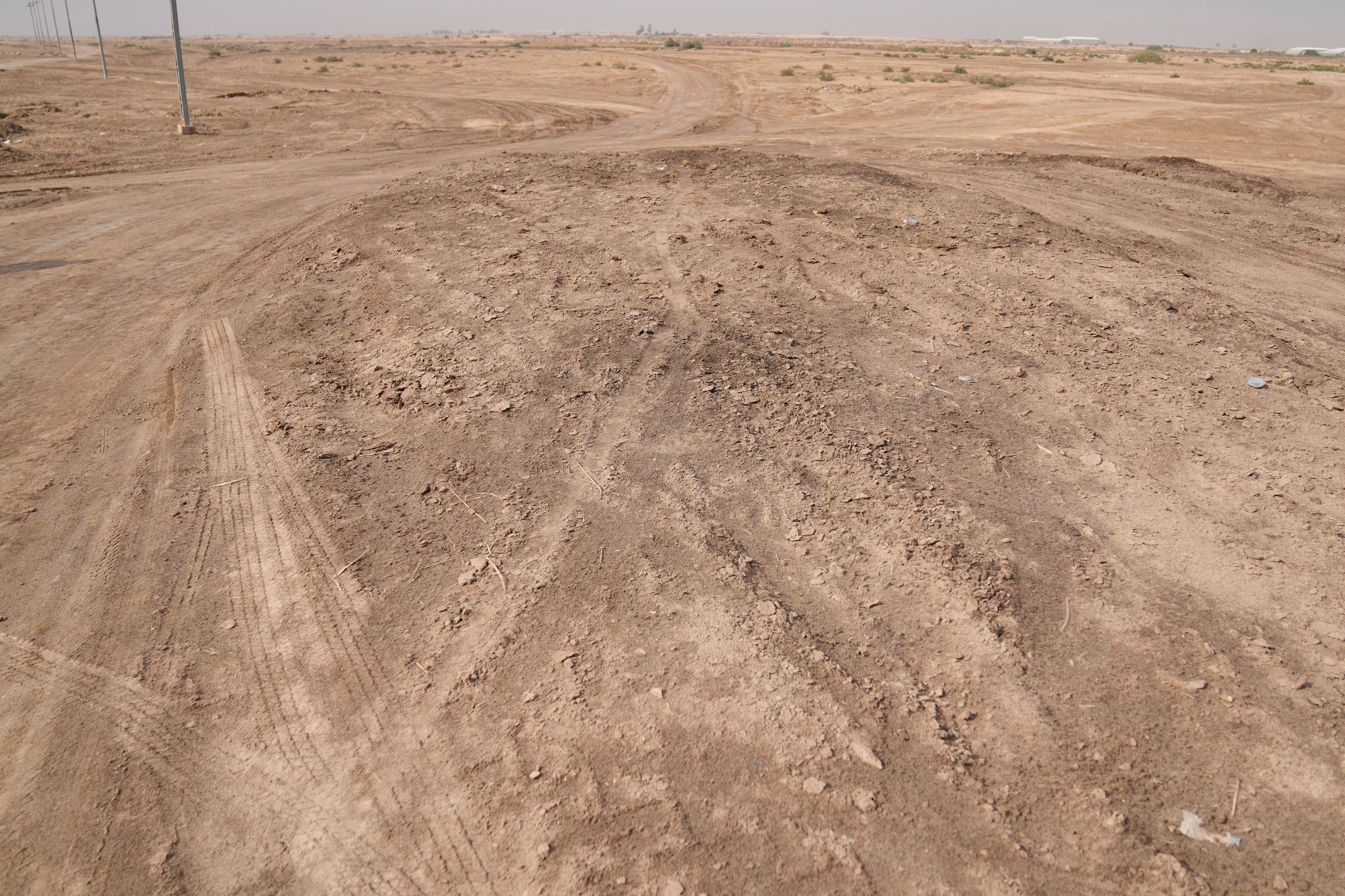 A desert area with scattered plots of agricultural land with features that closely matched the description of the al-Qadisiyah battle site described in historic texts. The Arab army prevailed in that battle and continued on its march into Persia, now Iran. Abu Sakhir district- southern Najaf, Iraq, Sunday, Nov.10, 2024. (AP Photo/Hadi Mizban)