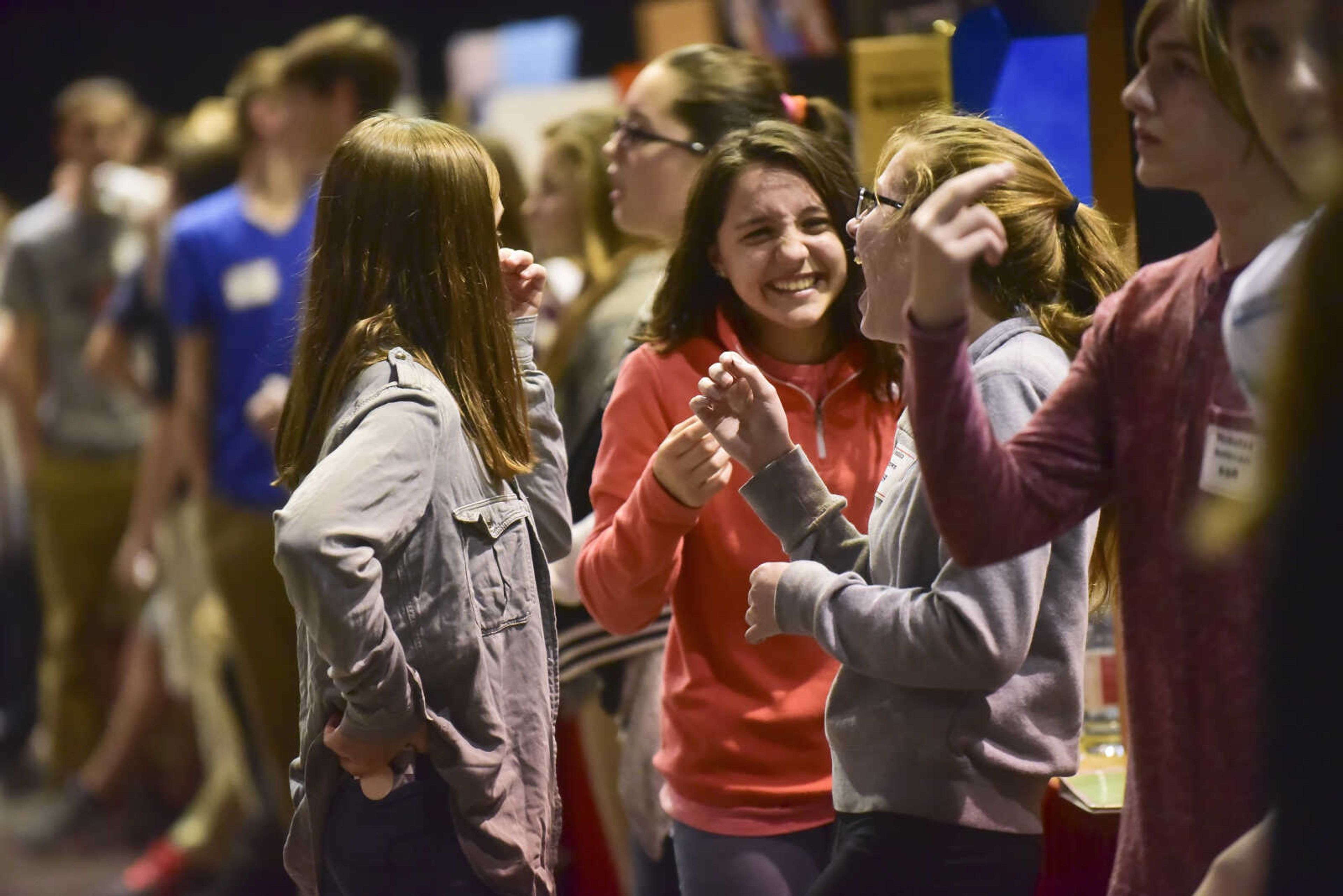 Kids laugh during the Southeast Missouri Regional Science Fair Tuesday, March 7, 2017 at the Show Me Center in Cape Girardeau.