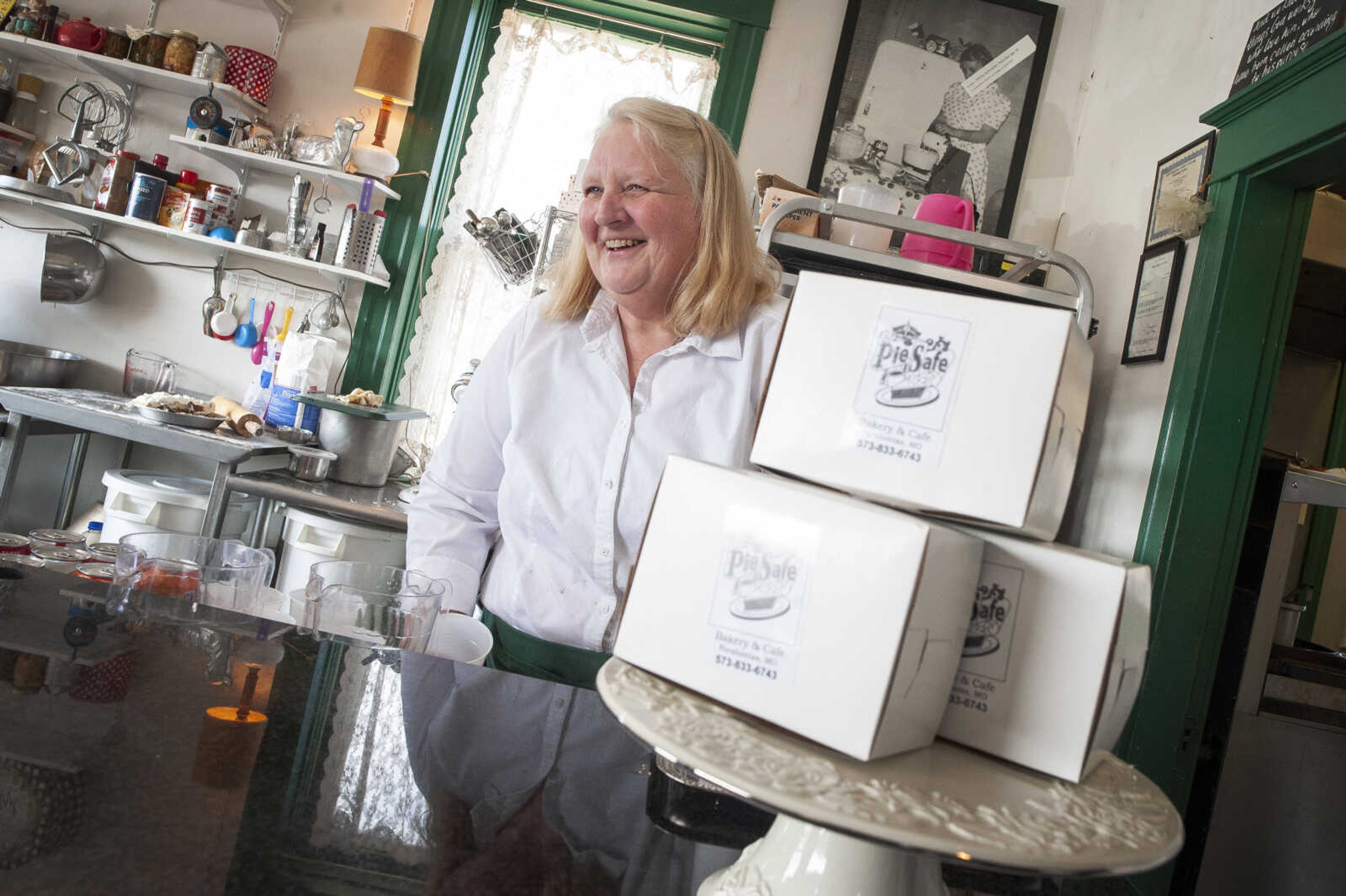 Sharon Penrod laughs with customers Wednesday, March 11, 2020, at The Pie Safe Bakery & Cafe in Pocahontas.