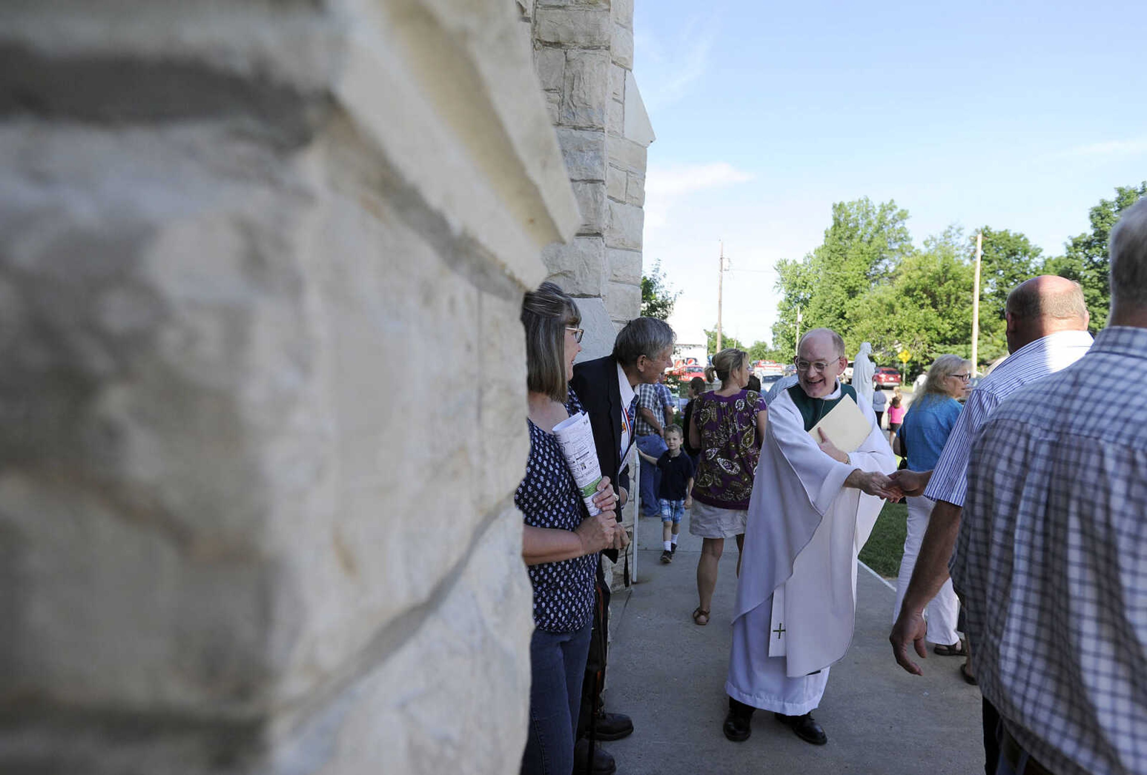 LAURA SIMON ~ lsimon@semissourian.com

The Rev. David Coon greets parishioner after mass in the newly remodeled St. John's Catholic Church in Leopold, Missouri on Sunday, May 29, 2016.