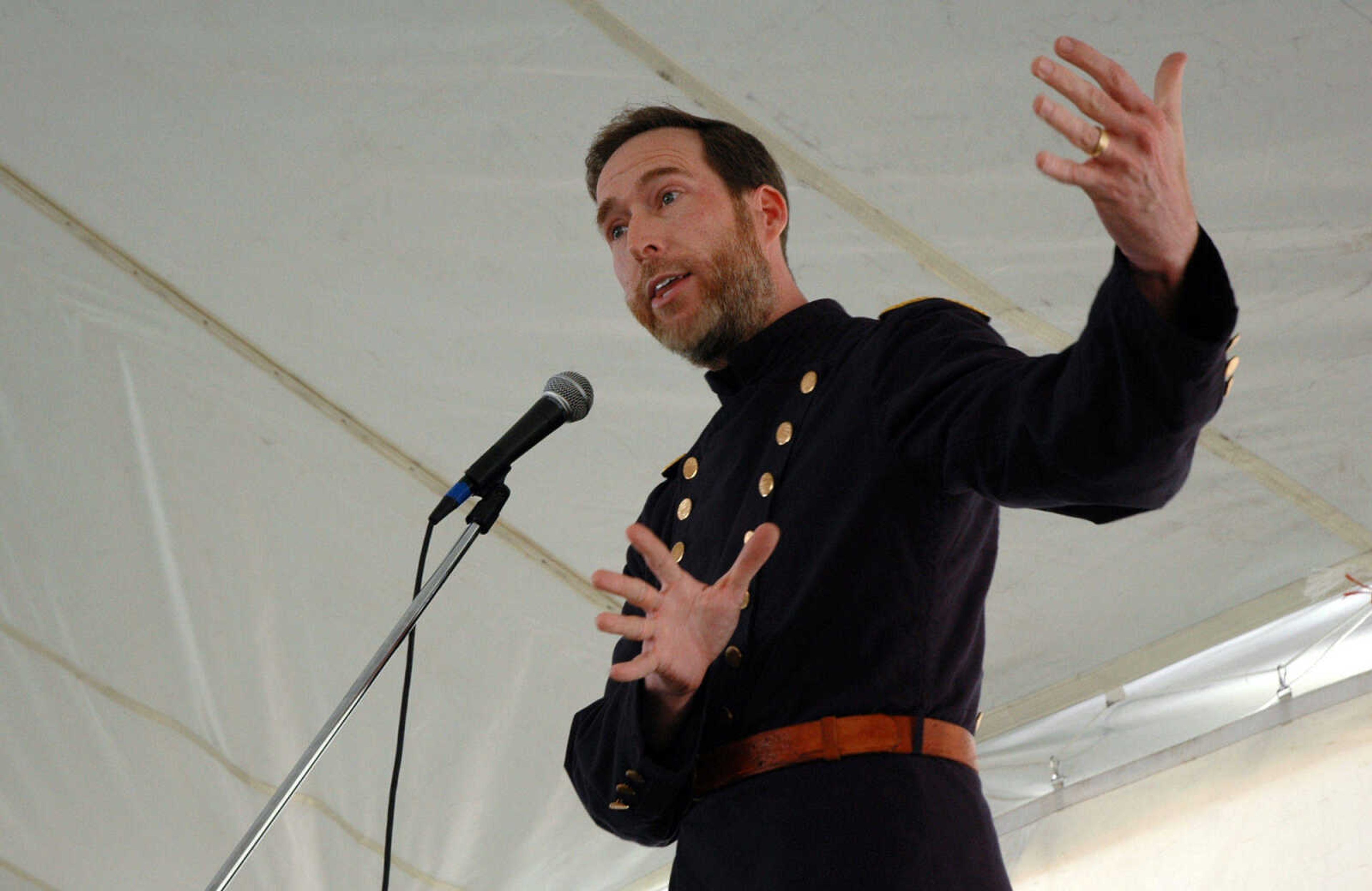 MELISSA MILLER ~ mmiller@semissourian.com

Chris Sutton, of St. Louis, tells a Civil War battle story during "swapping ground" at the Storytelling Festival in Cape Girardeau, Mo., on Saturday, April 10, 2010. The swapping ground portion of the festival allows anyone the chance to take the stage and try their hand at storytelling.