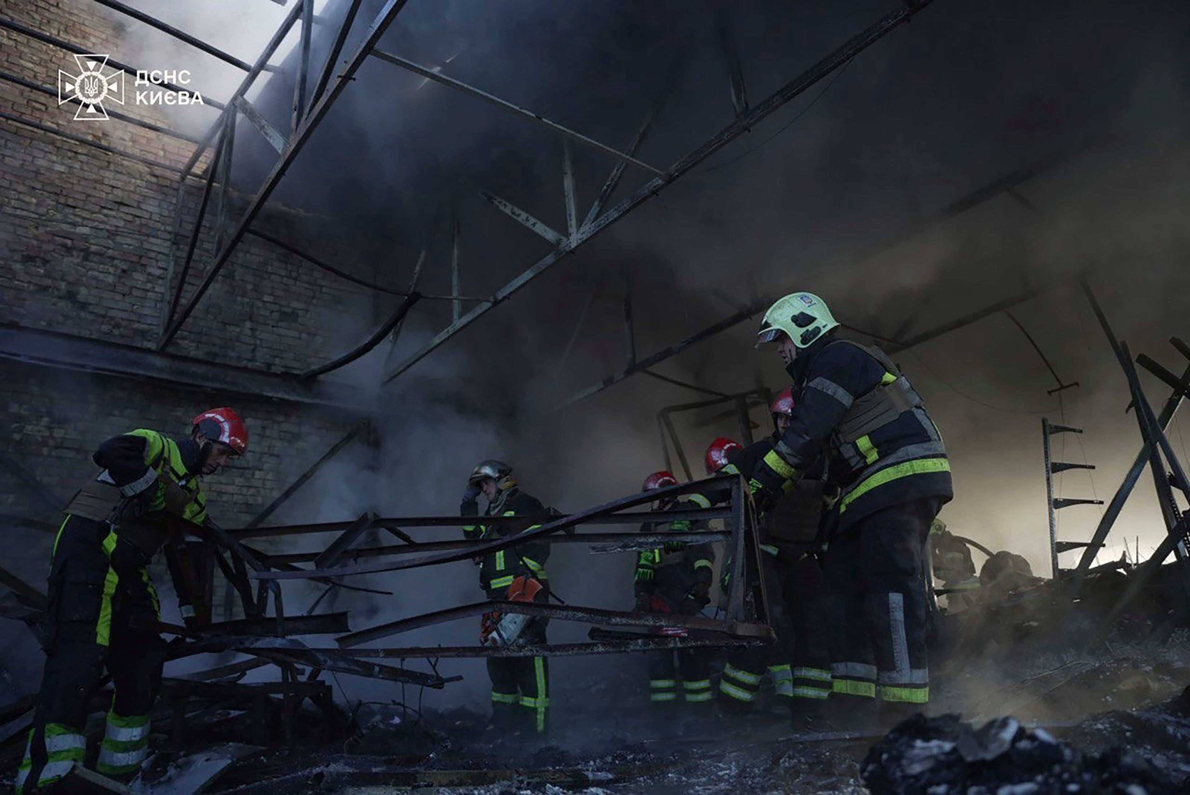 In this photo provided by the Ukrainian Emergency Service on Thursday, Nov. 7, 2024, rescuers clear the rubble of a damaged building which was resulted from Russian drone attack in Kyiv, Ukraine. (Ukrainian Emergency Service via AP)