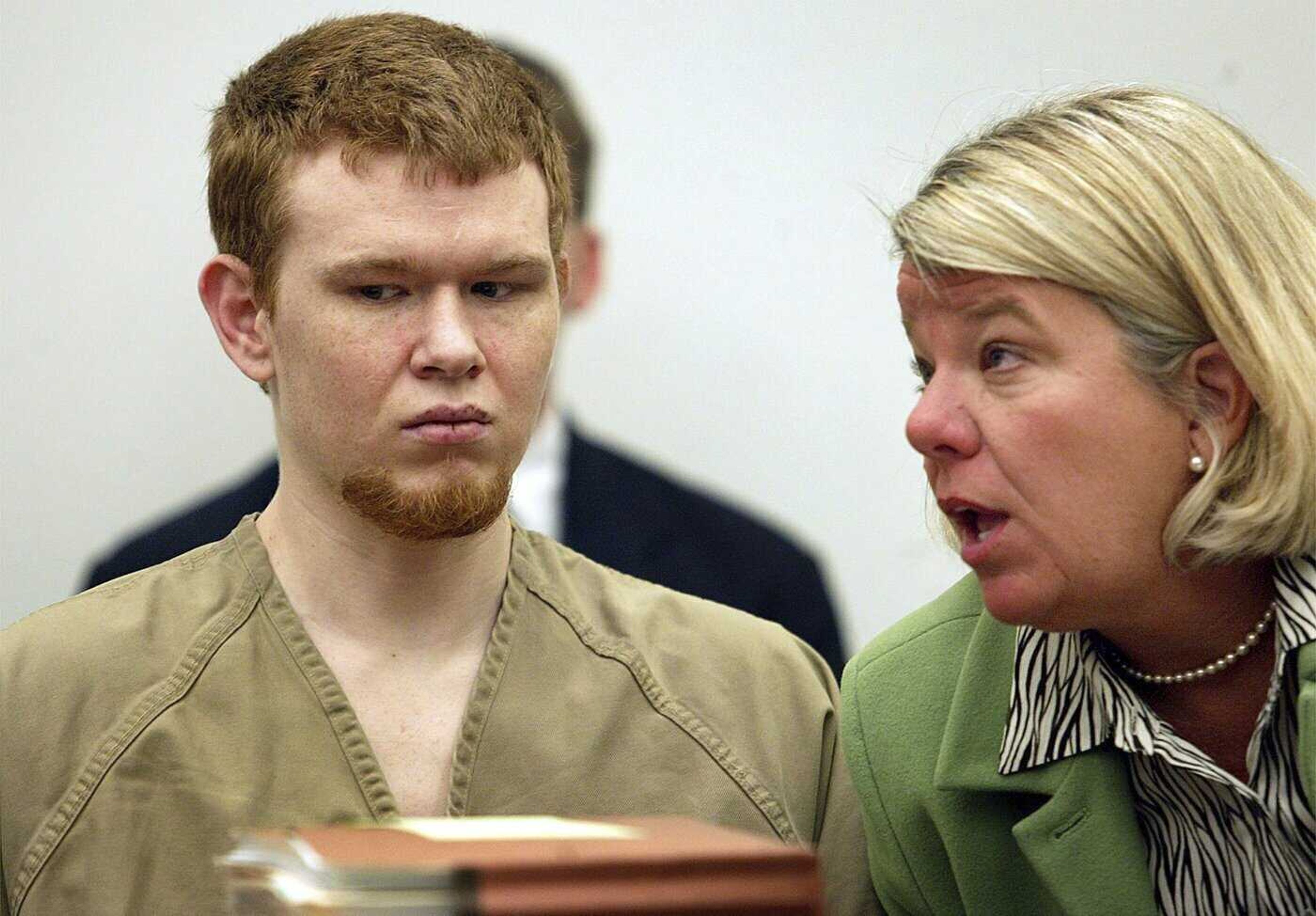 Johnny Johnson, left, listens as his attorney Bevy Beimdiek speaks during his sentencing hearing March 7, 2005, in St. Louis County Court in Clayton, Missouri.