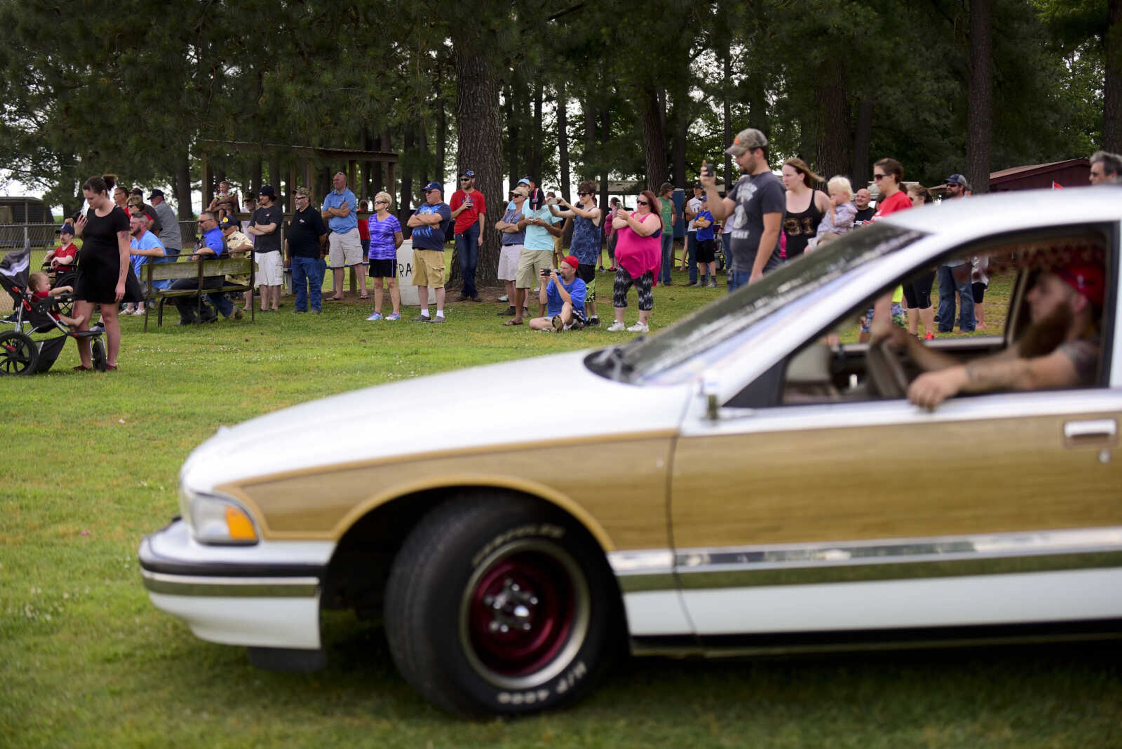 People watch the burnout contest during the 22nd annual Oran Car Show at George Tilles Jr. Memorial Park Saturday, June 3, 2017 in Oran.