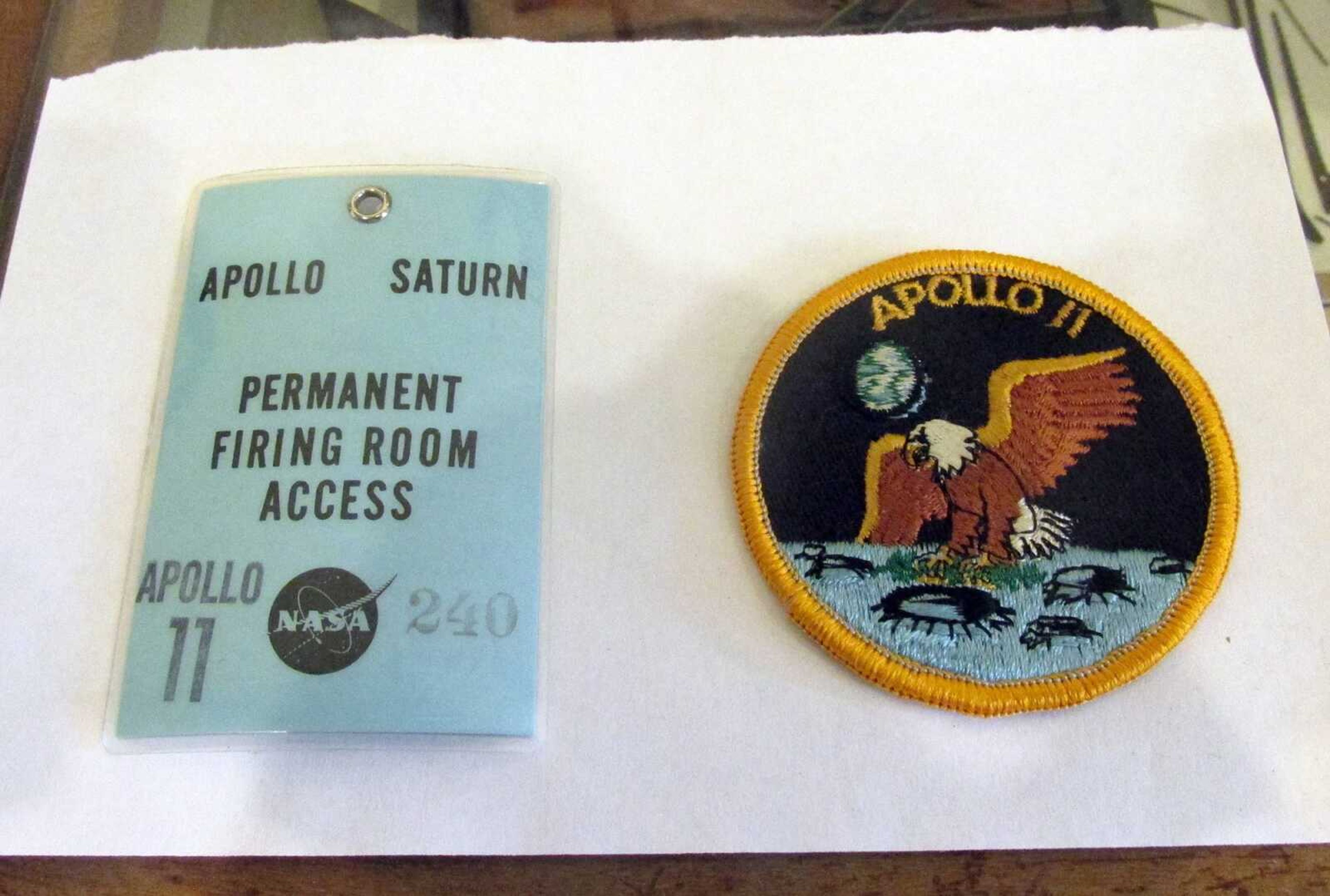 An Apollo Saturn ID badge and Apollo 11 patch are seen at the Union County Museum in Cobden, Illinois.