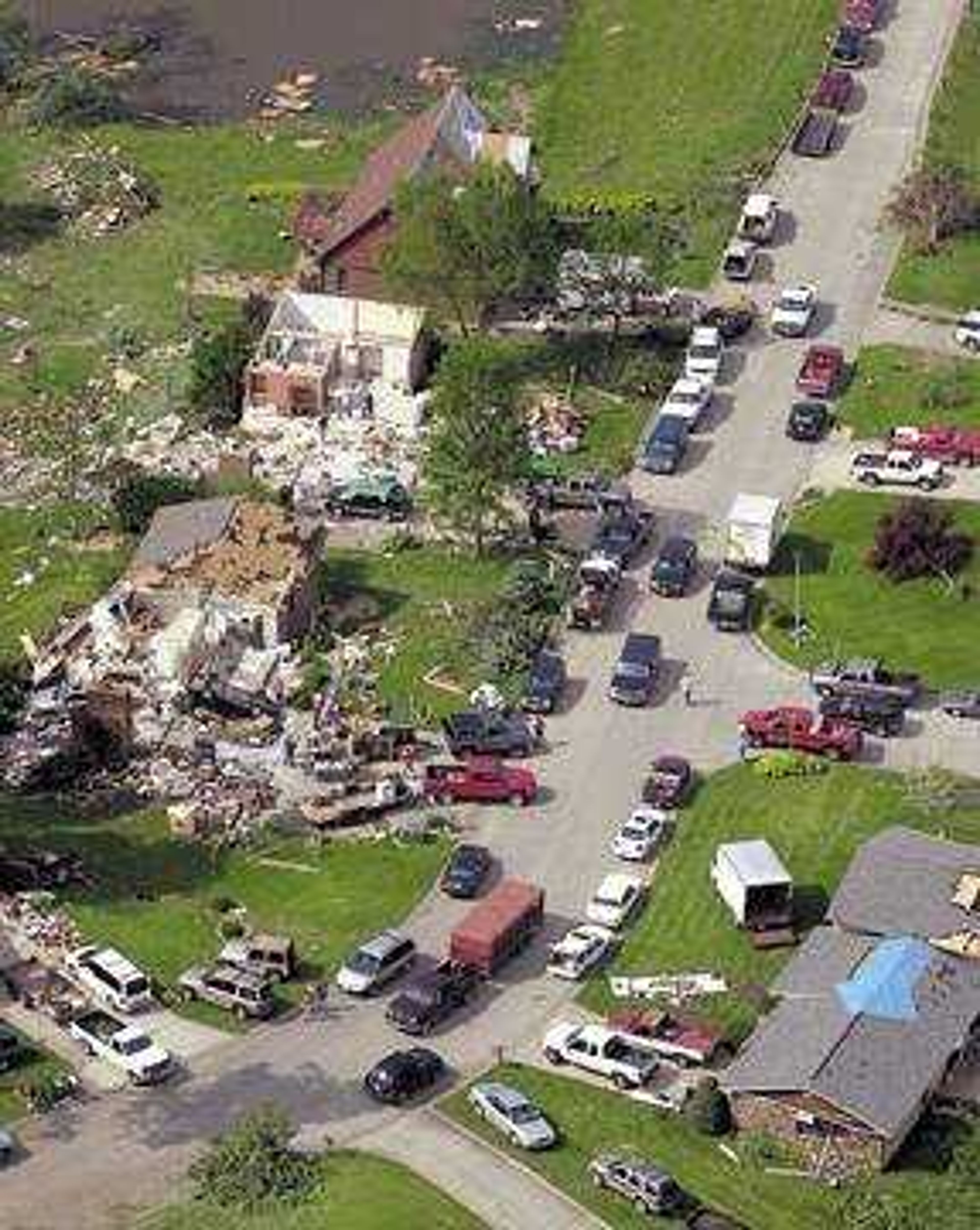 Friends and neighbors with pickup trucks and trailers helped residents salvage what they could from their homes Wednesday afternoon.