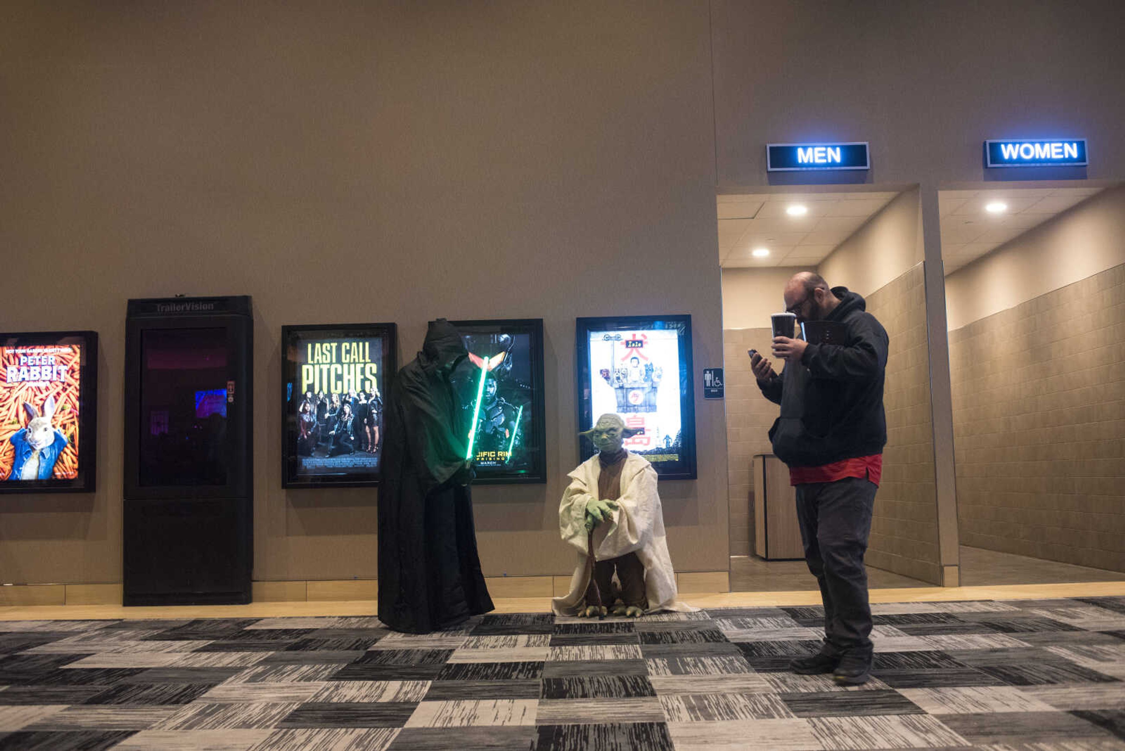 Elias Raley and Trey Kerley with the Southern Illinois Jedi Order wait in the lobby before the showing of Star Wars: The Last Jedi Thursday, Dec. 14, 2017 at Cape West Cinema in Cape Girardeau.