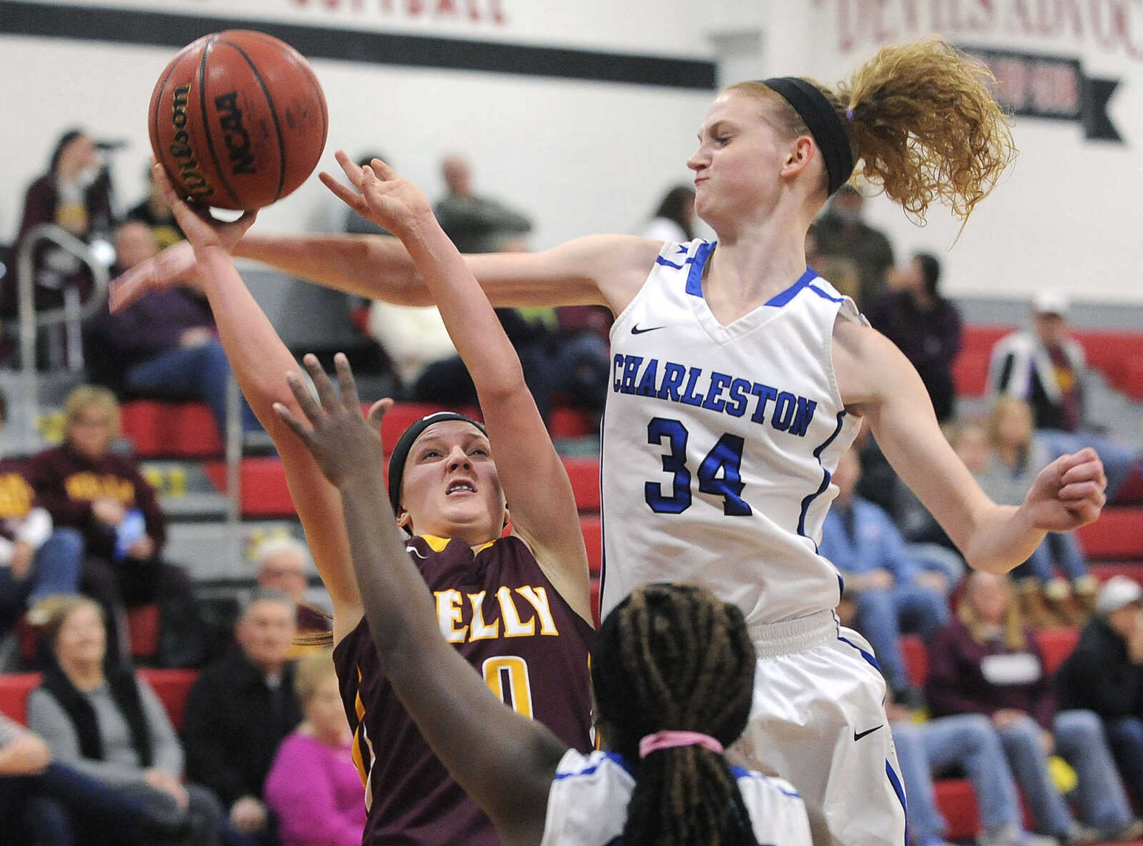 FRED LYNCH ~ flynch@semissourian.com
Kelly's Mallory Urhahn tries to shoot as Charleston's Connor Watkins defends during the first quarter of a first-round game in the Scott-Mississippi Conference Tournament Monday, Jan. 11, 2016 in Chaffee, Missouri.