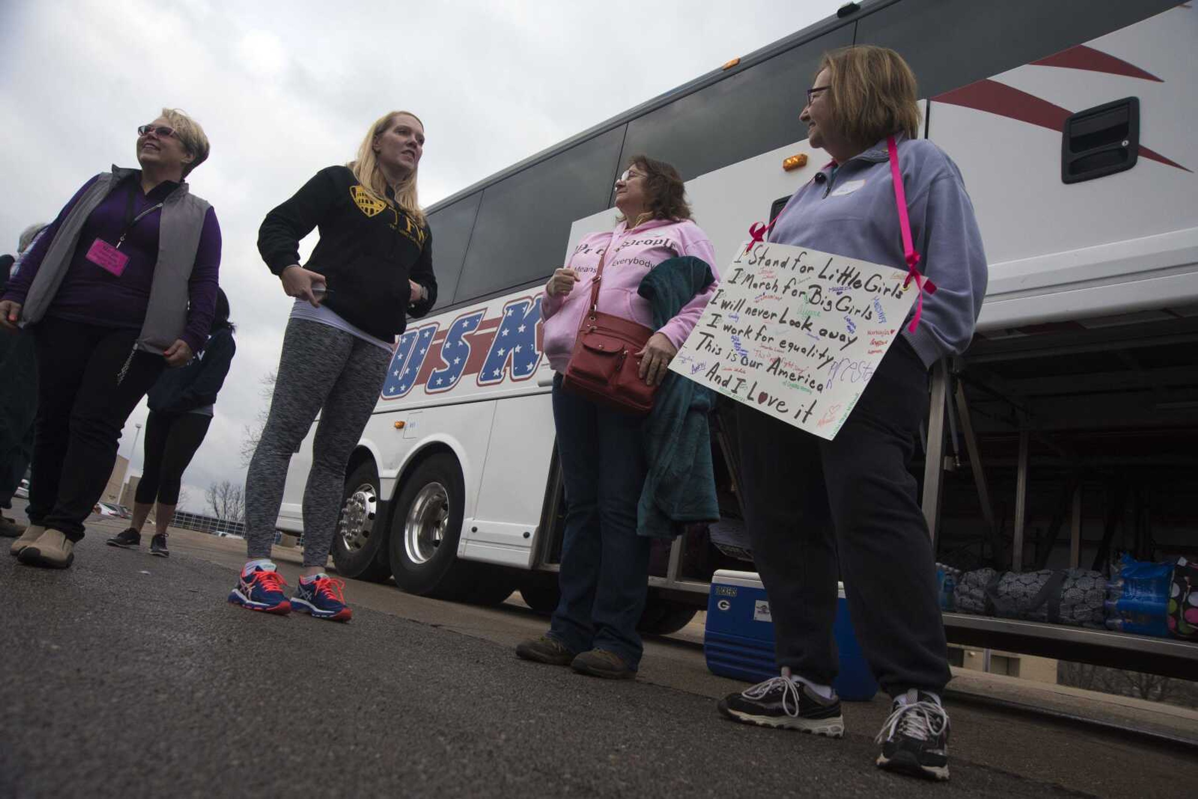 Protestors get ready to travel to Washington D.C. to participate in the Women's March on Saturday as they get ready to leave Friday, Jan. 20, 2017 in the Scully Building parking lot at Southeast Missouri State University in Cape Girardeau.