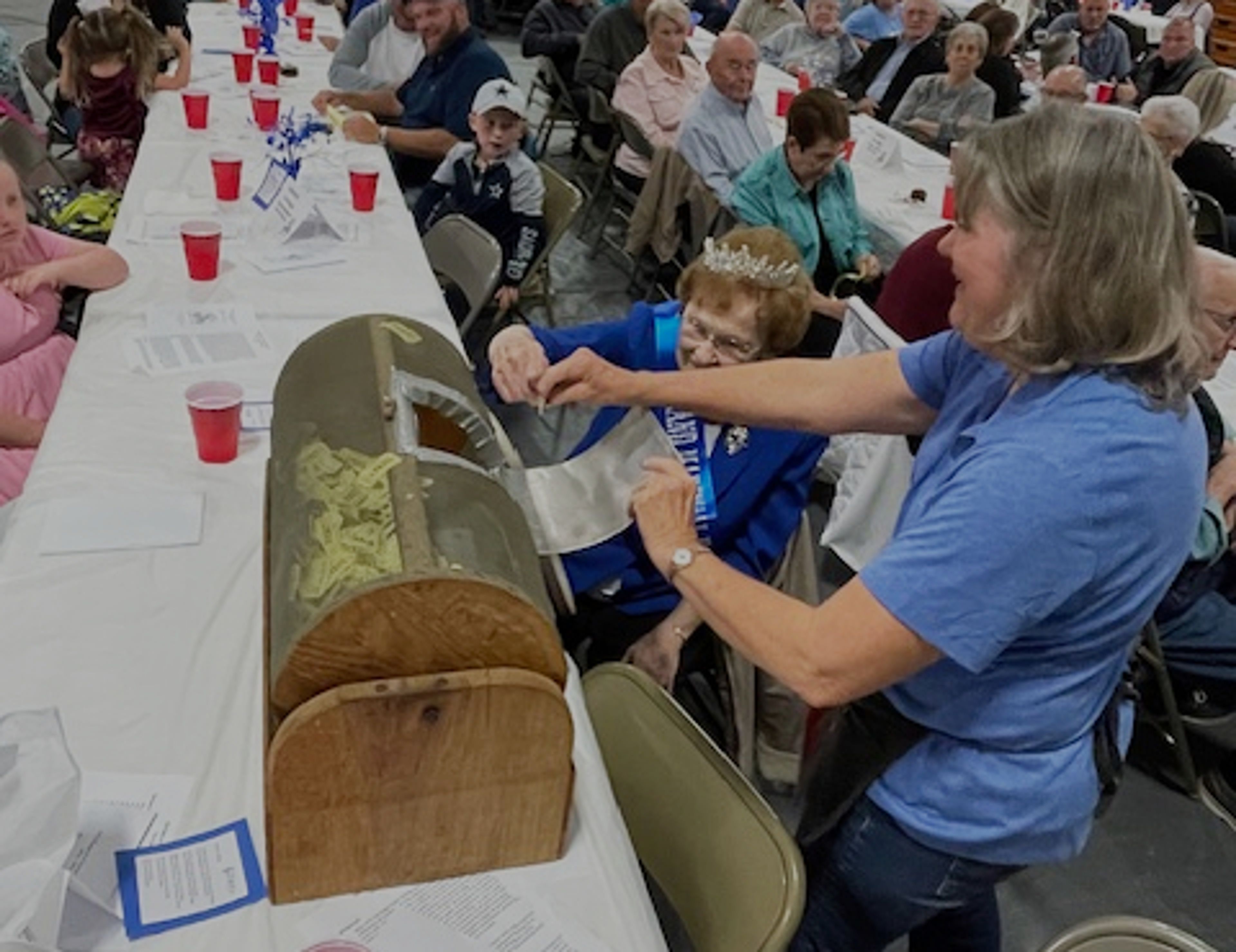 Grand Marshal Helen Ford McFerron assists with a raffle during Oak Ridge's sesquicentennial celebration on Saturday, Nov. 9.