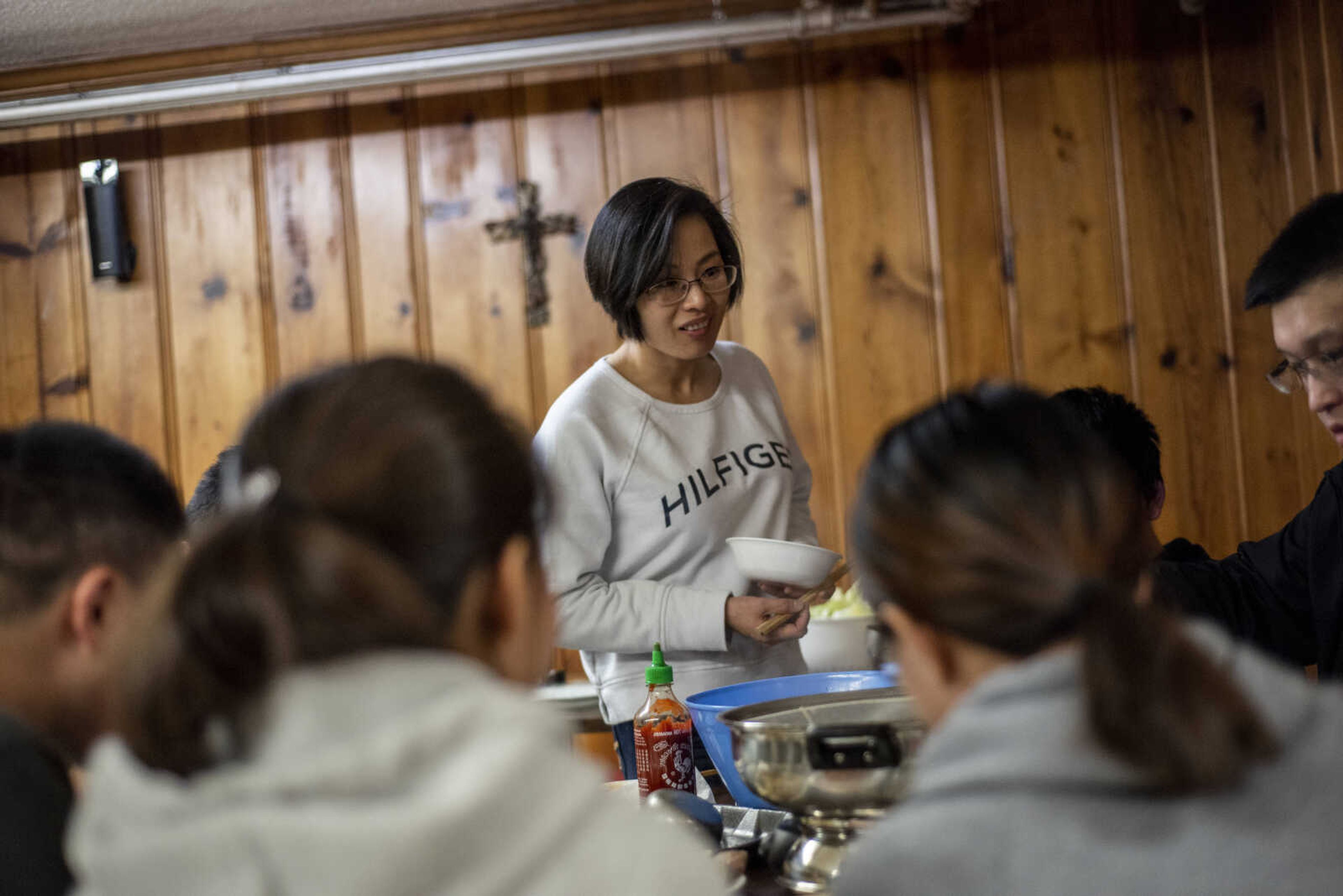 Dr. Chen Wu shares a traditional Chinese-style hotpot meal with students before the weekly Bible study Friday, March 8, 2019, at the Southeast Missouri State University Baptist Student Center in Cape Girardeau.