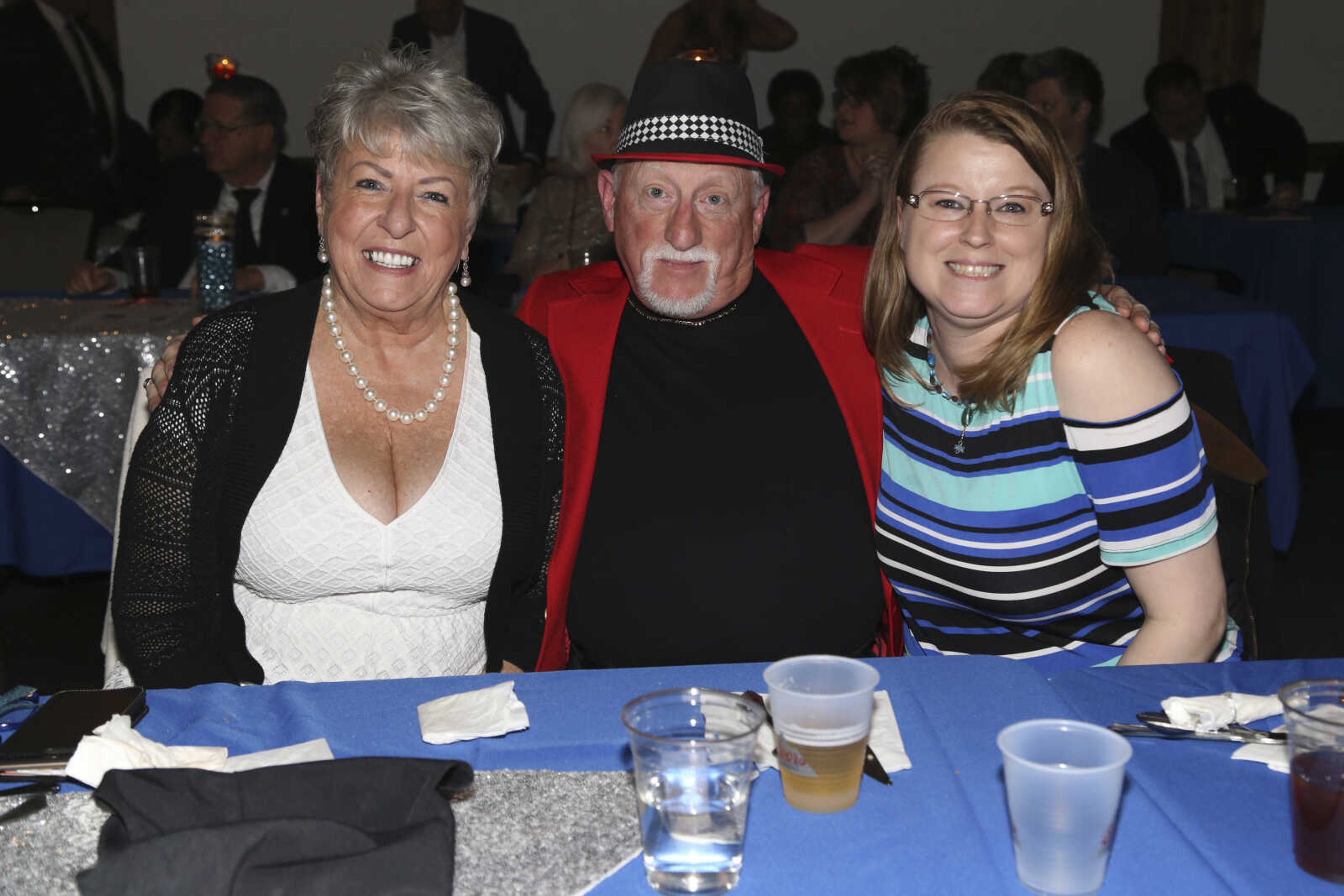 Irene Baldwin, left, Herman Lintner, center, and Kelly Darby pose for a photo Saturday, Feb. 3, 2018, during the Fire and Ice Gala at Bavarian Halle in Jackson.