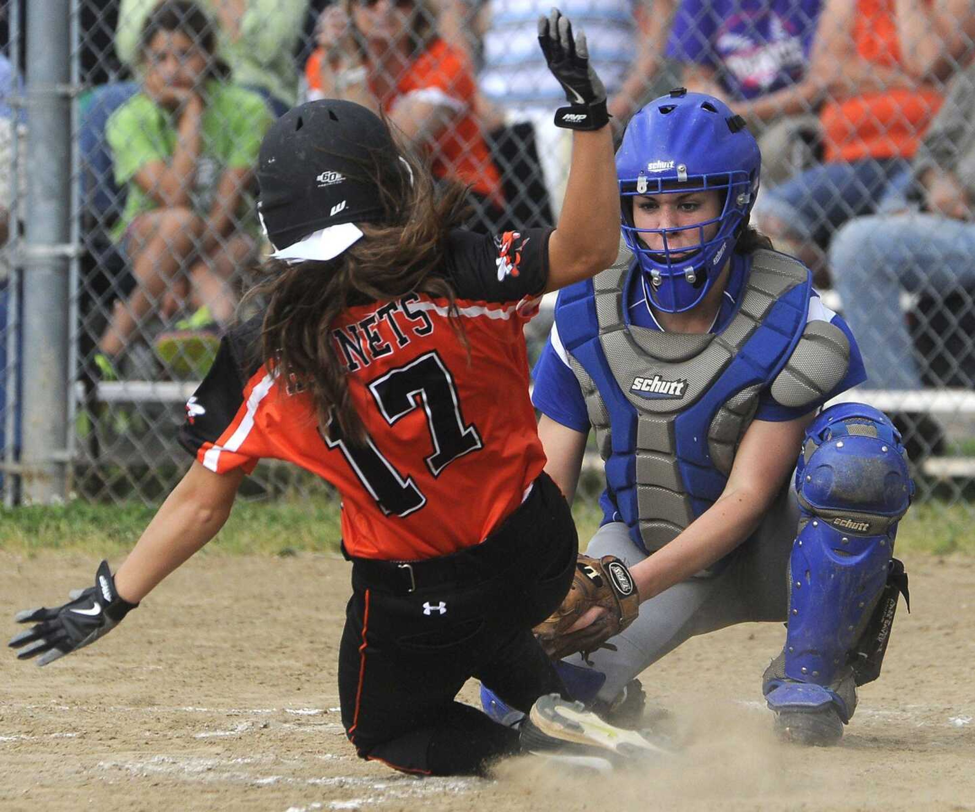 Leopold catcher Ashlyn Bucher tags out Advance runner Kendra Sokolowski at the plate during the third inning of a semifinal game of the Class 1 District 4 softball tournament Tuesday, May 5, 2015 in Scott City. (Fred Lynch)