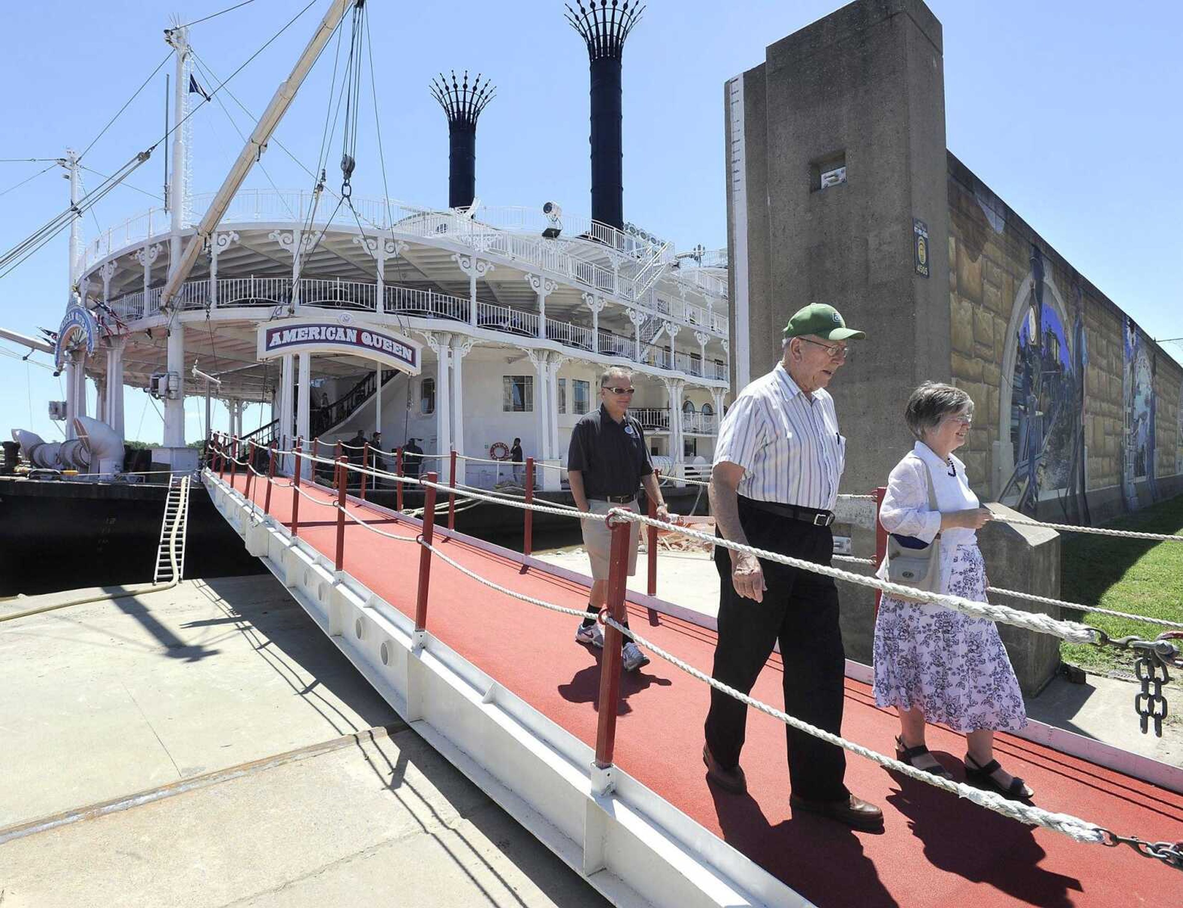 Passengers of the American Queen riverboat disembark for a bus tour of the city Friday in Cape Girardeau. (Fred Lynch)